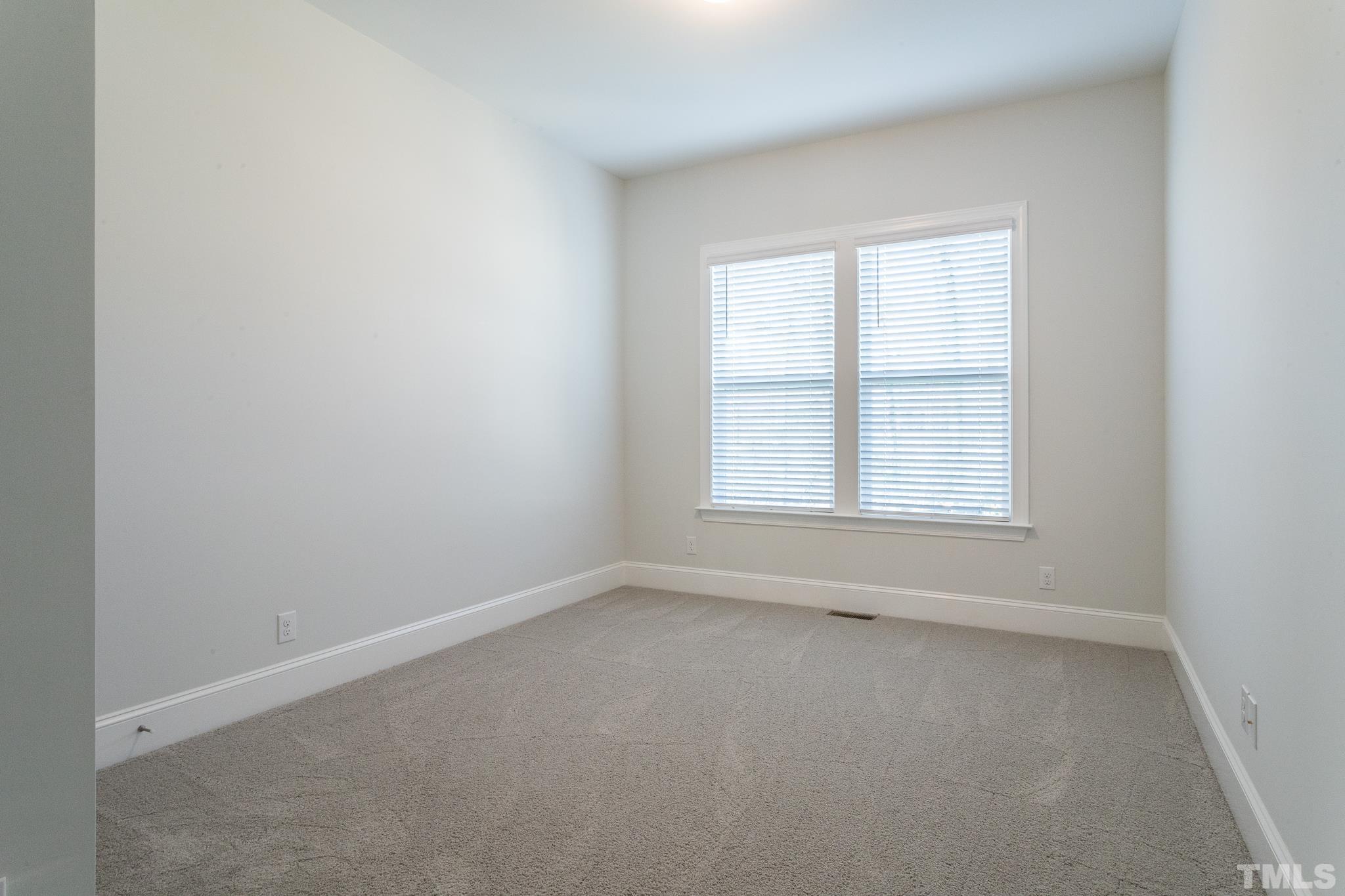 5601 Norcrest Street Raleigh, NC 27612 - Photo 28 of 41 an empty room with a window