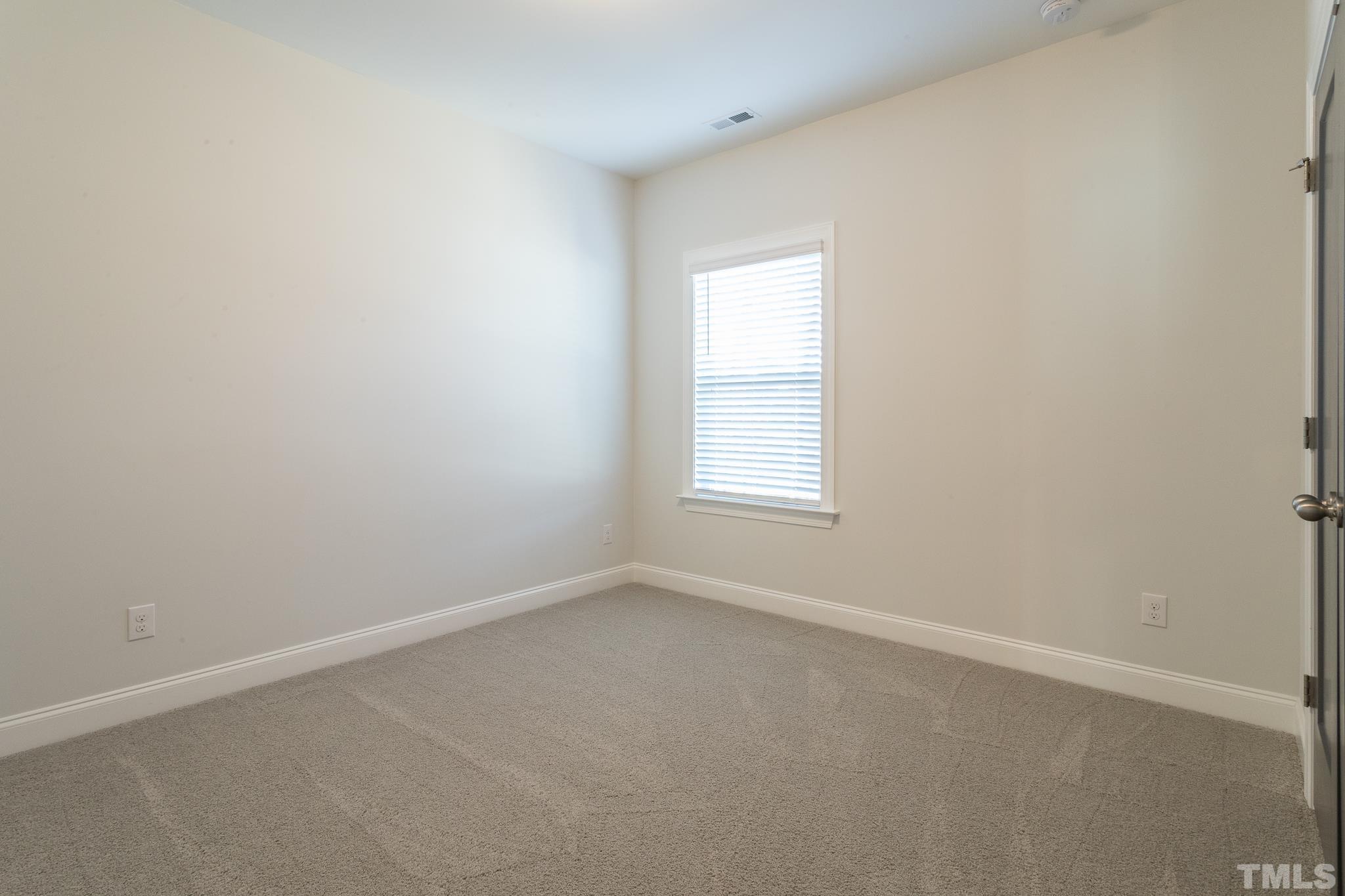 5601 Norcrest Street Raleigh, NC 27612 - Photo 30 of 41 an empty room with a window