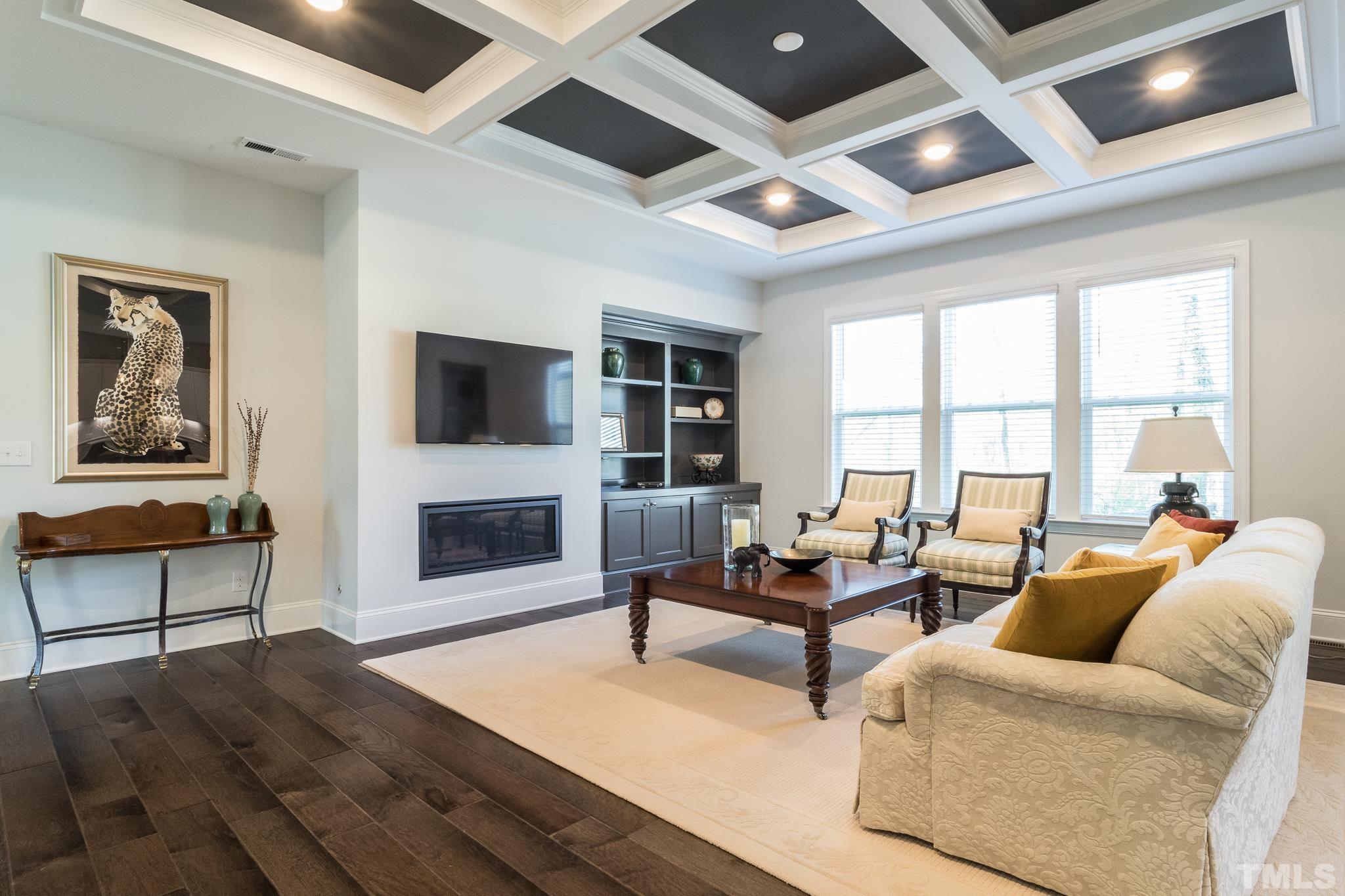 5601 Norcrest Street Raleigh, NC 27612 - Photo 3 of 41 a living room with furniture large window and flat screen tv