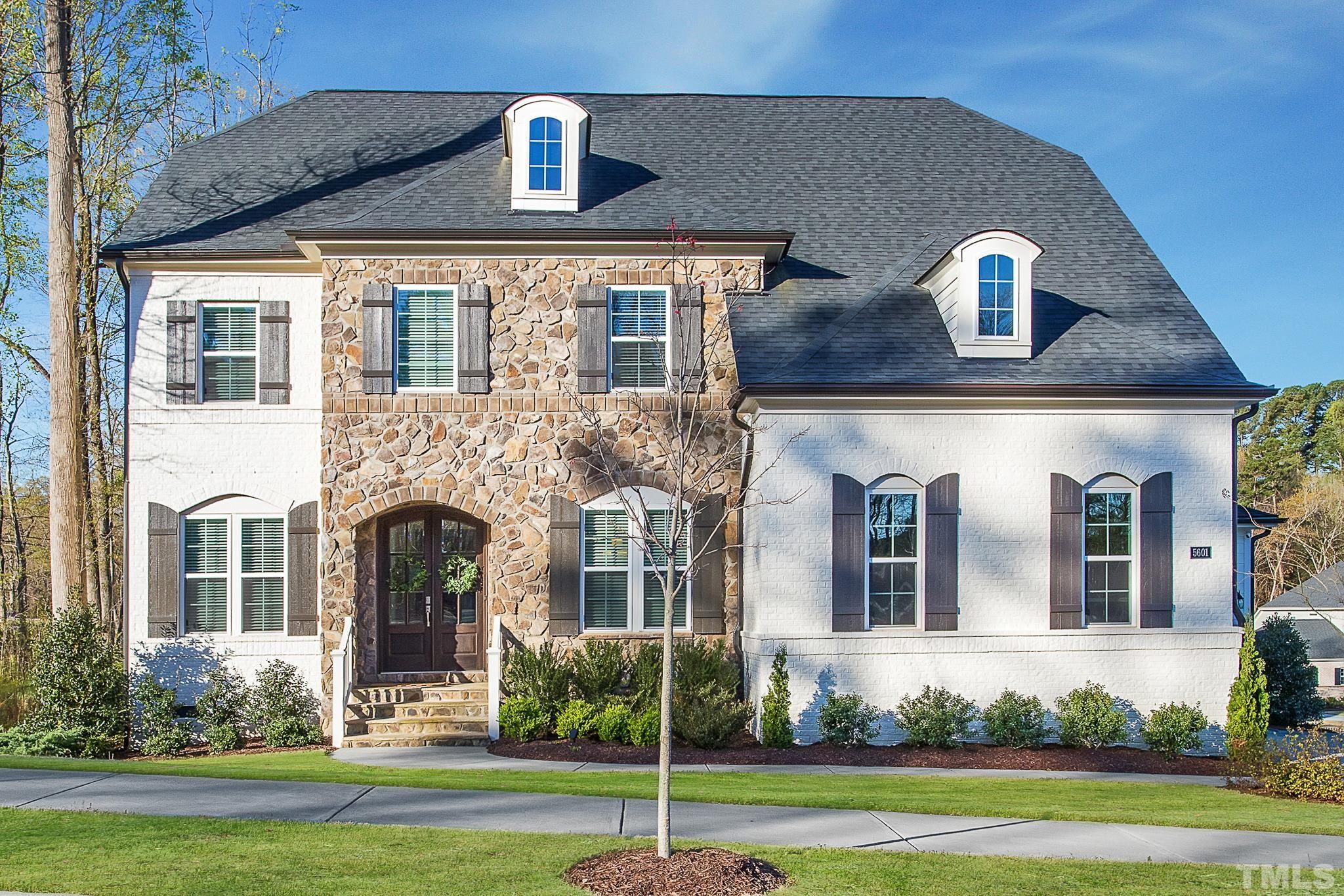 5601 Norcrest Street Raleigh, NC 27612 - Photo 41 of 41 a front view of a house with a yard