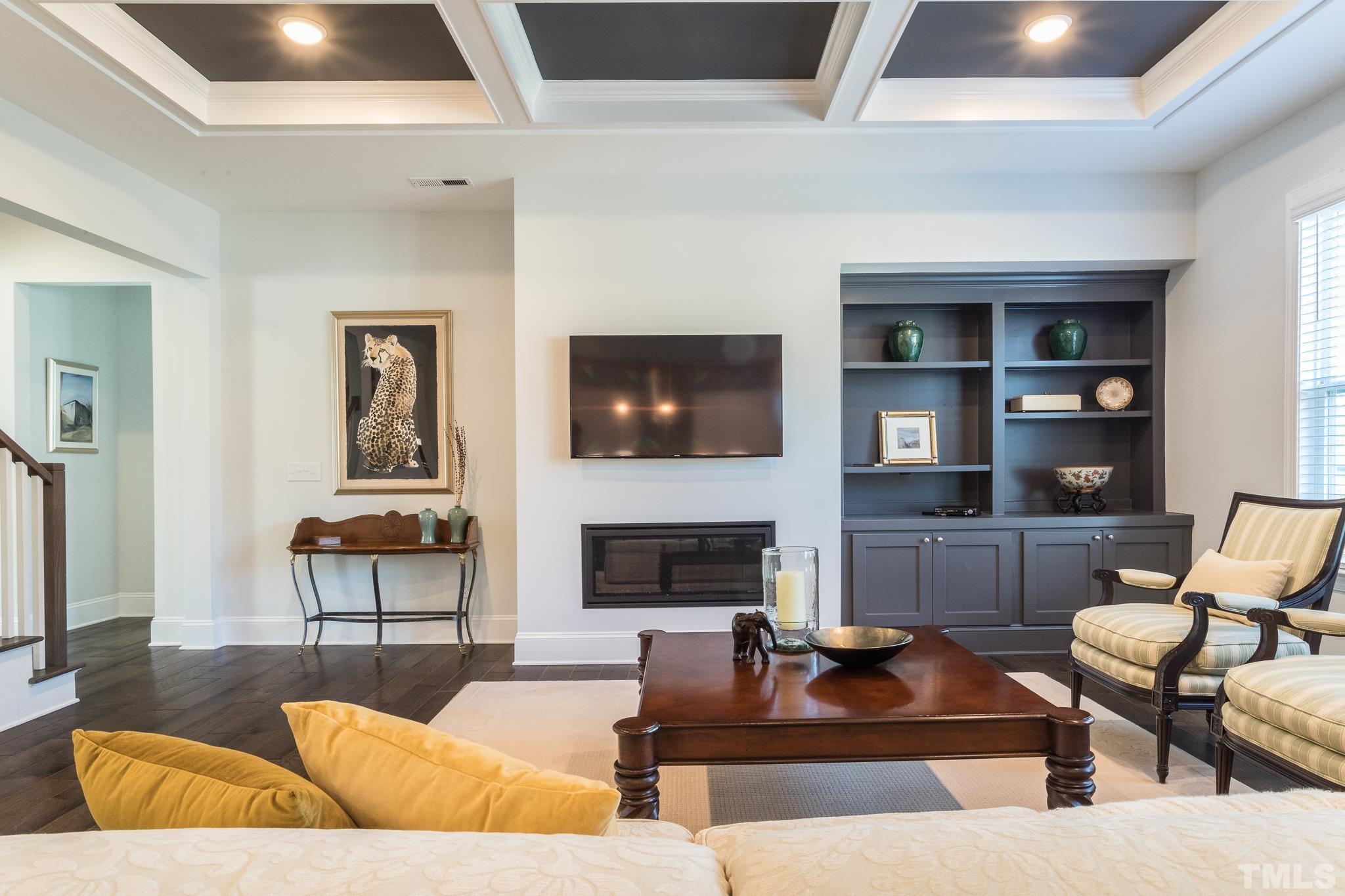 5601 Norcrest Street Raleigh, NC 27612 - Photo 10 of 41 a living room with furniture and a fireplace