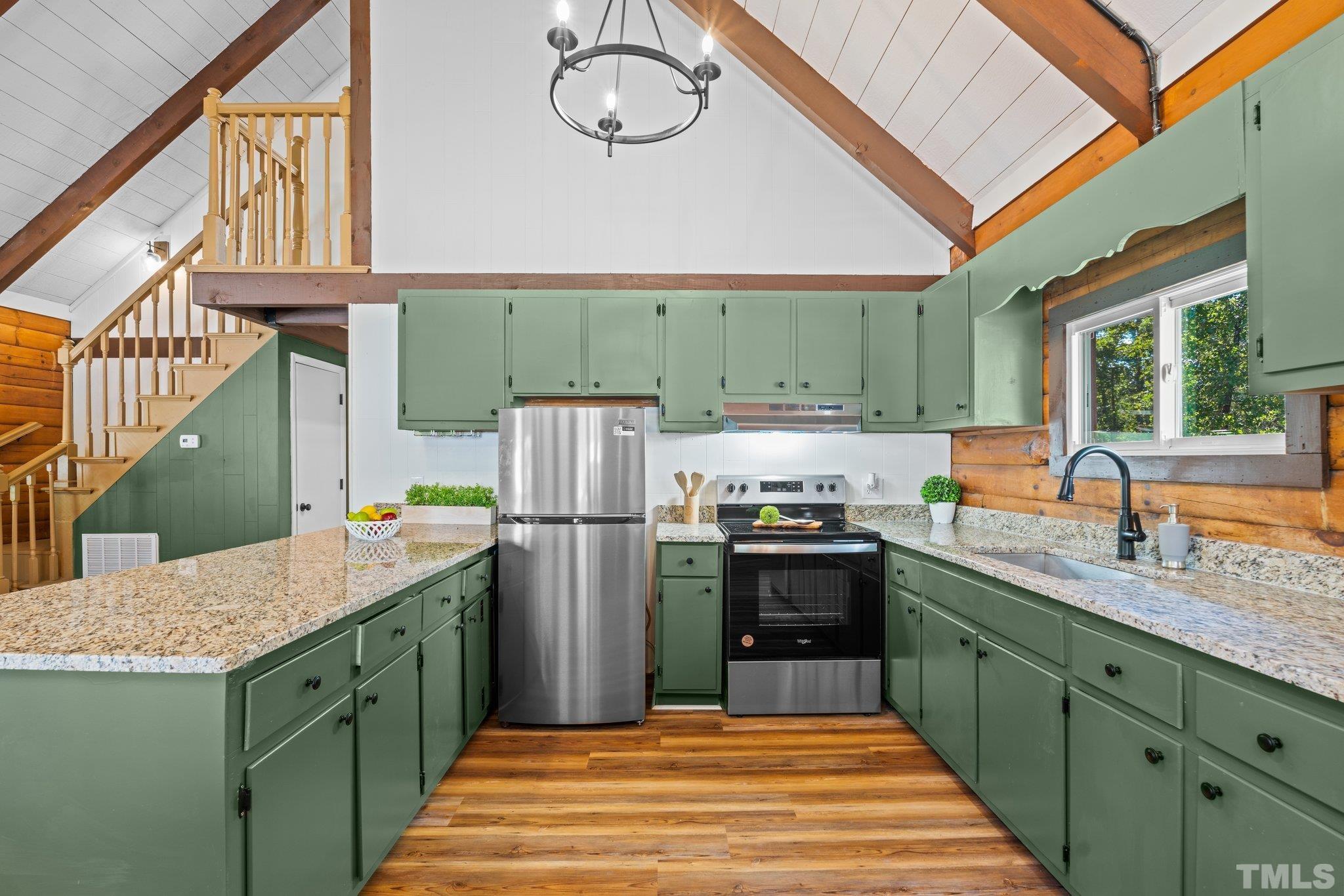 2296 Nursery Road Lillington, NC 27546 - Photo 14 of 43 a kitchen with a refrigerator and a sink