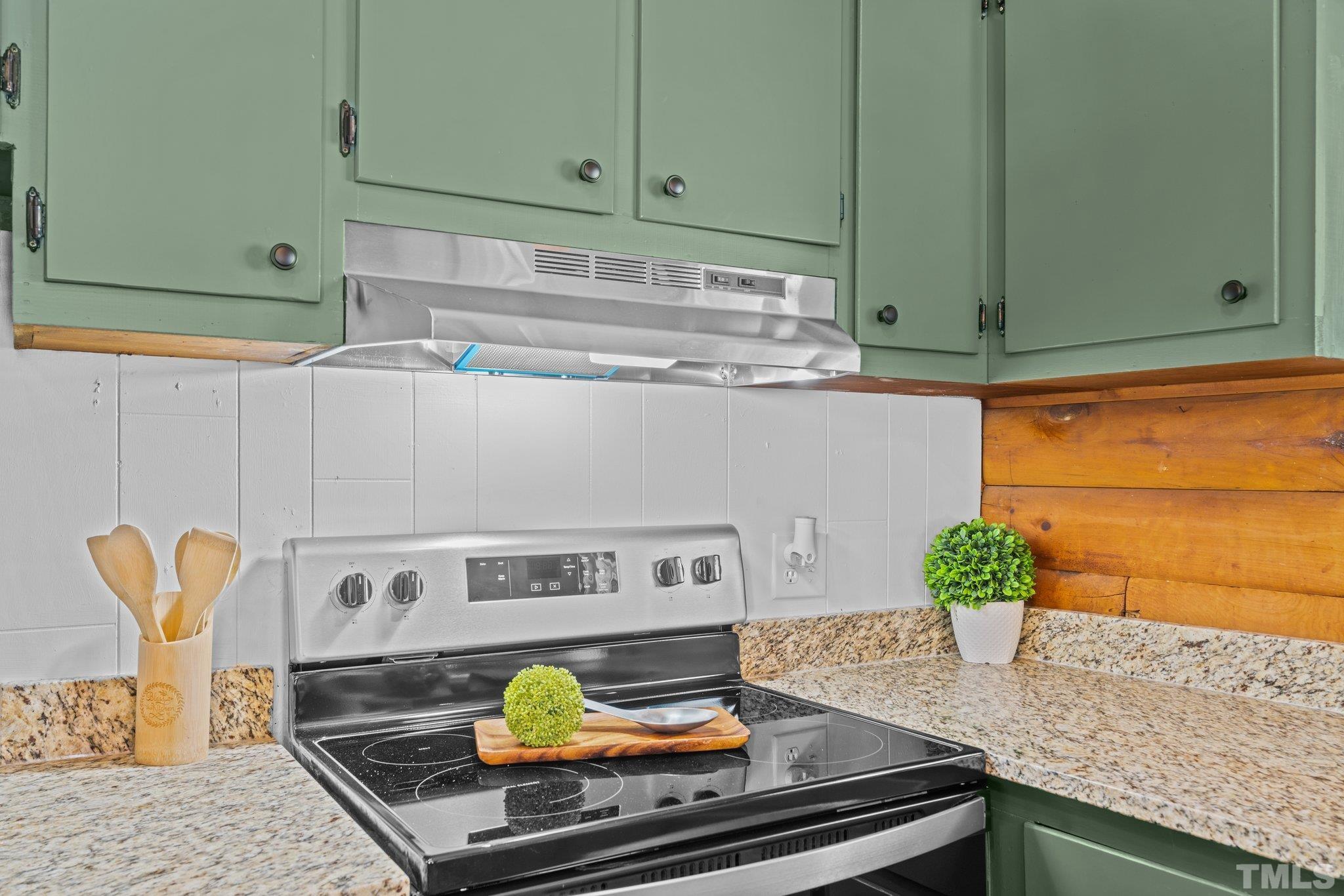 2296 Nursery Road Lillington, NC 27546 - Photo 16 of 43 a kitchen with a stove and cabinets