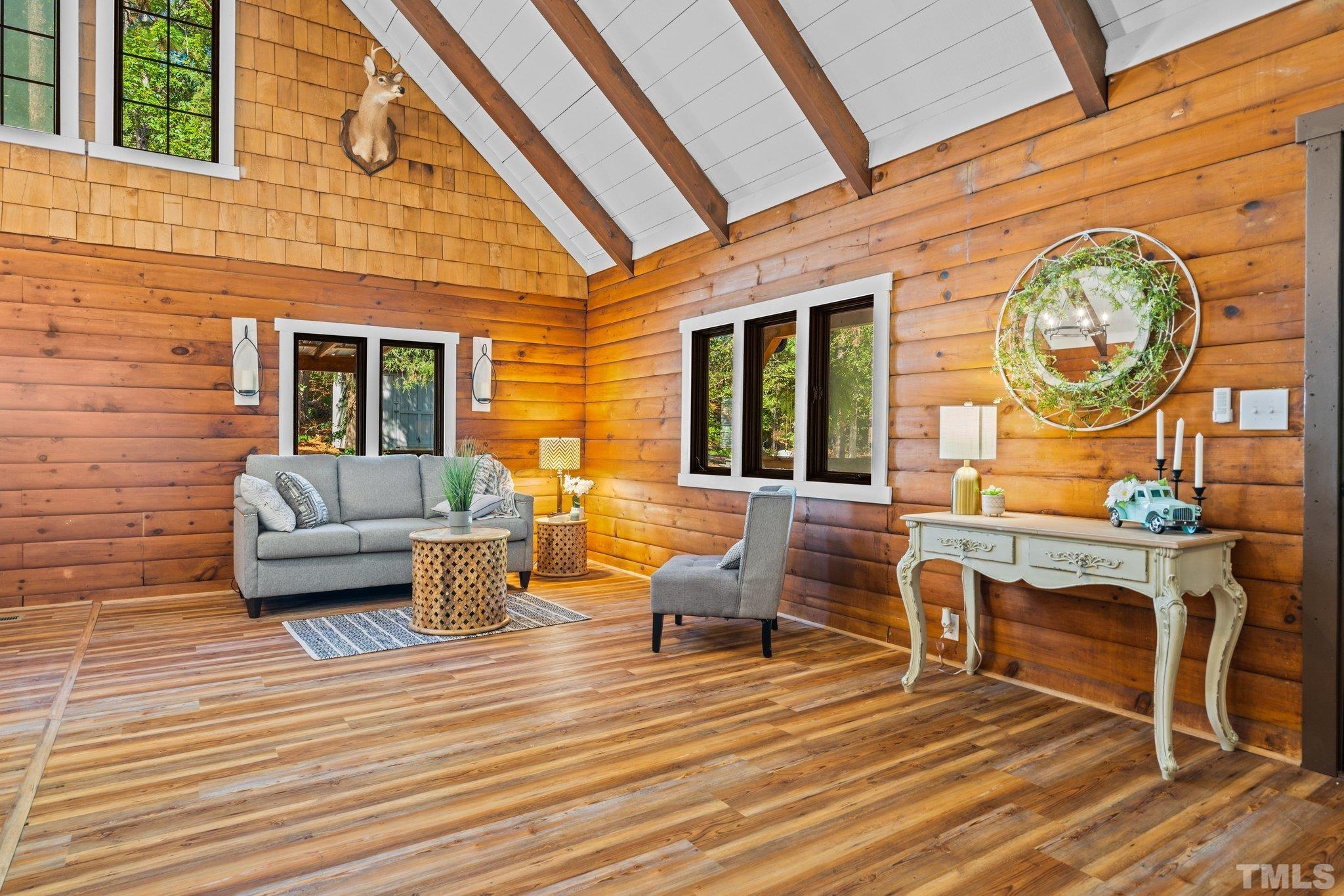 2296 Nursery Road Lillington, NC 27546 - Photo 27 of 43 a living room with furniture and a wooden floor