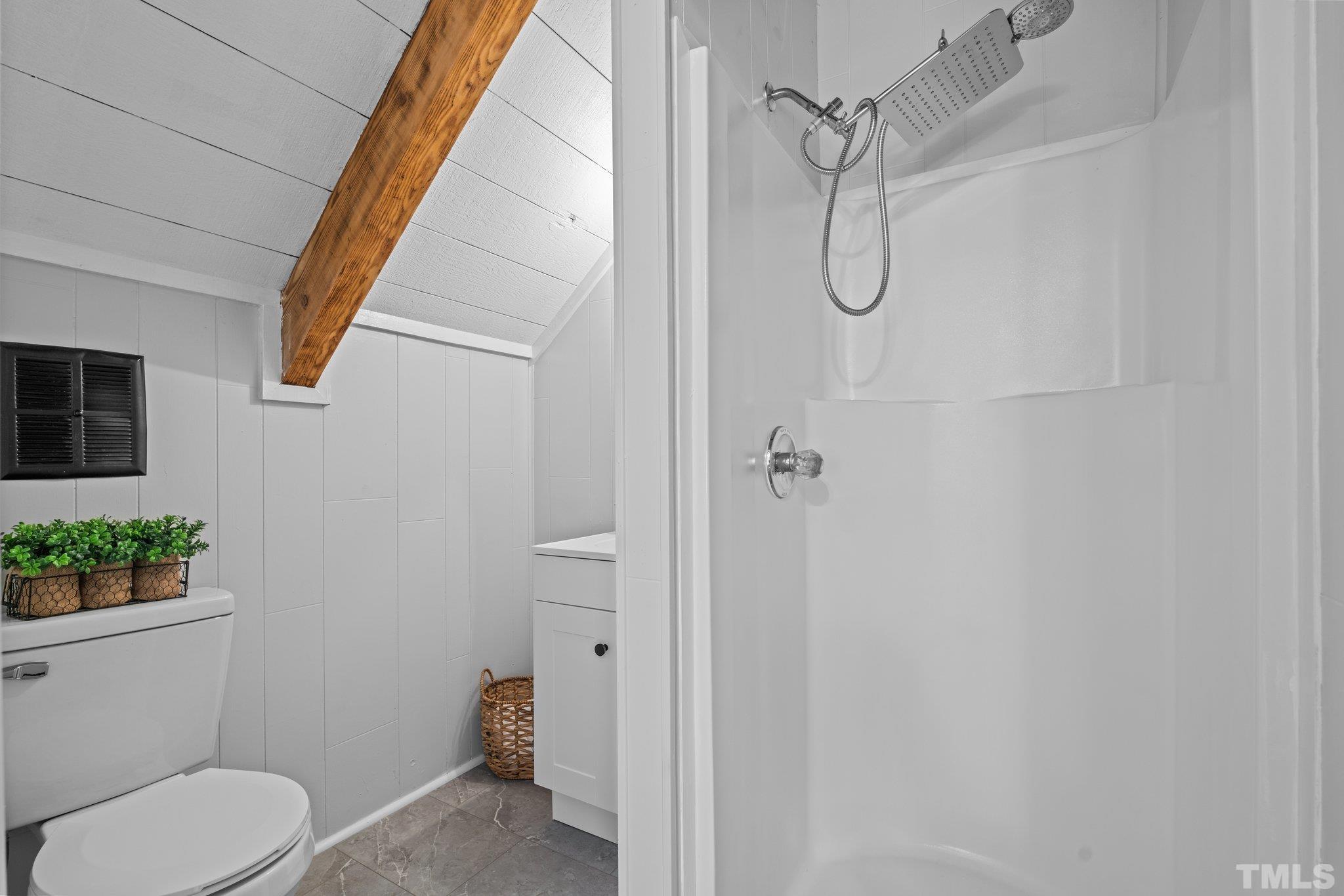 2296 Nursery Road Lillington, NC 27546 - Photo 30 of 43 a bathroom with a granite countertop shower and a toilet