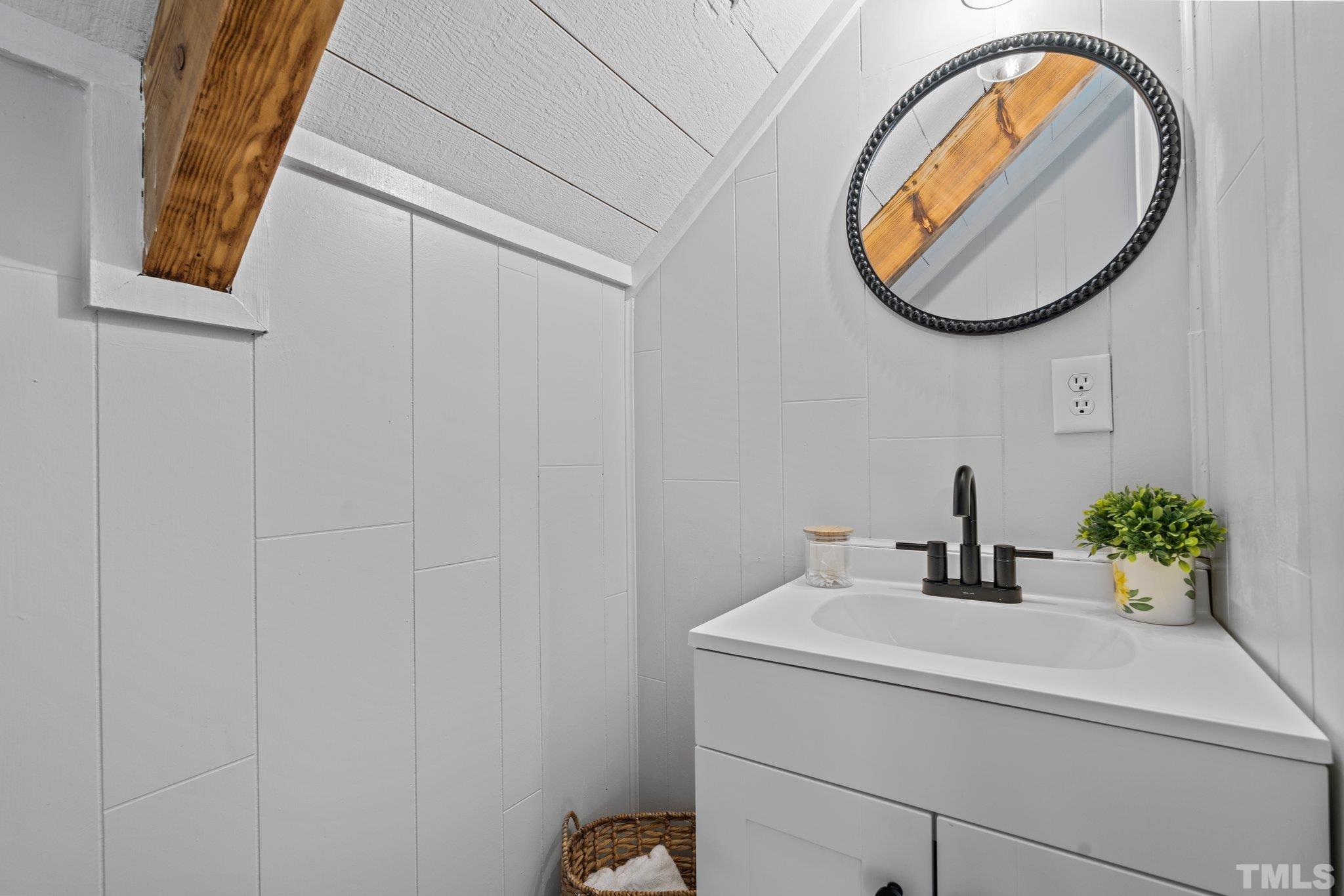 2296 Nursery Road Lillington, NC 27546 - Photo 31 of 43 a bathroom with a sink and a mirror