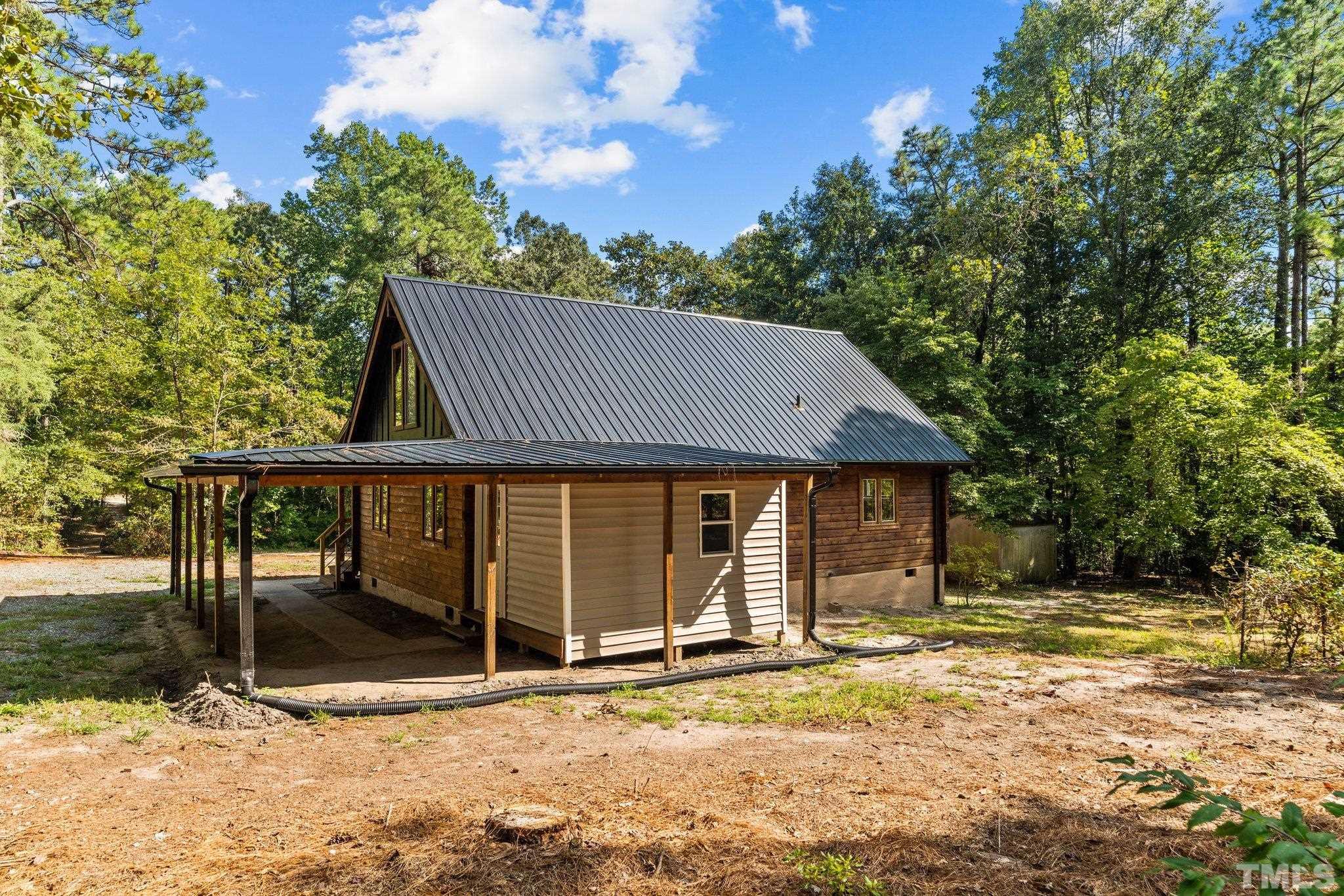 2296 Nursery Road Lillington, NC 27546 - Photo 37 of 43 a front view of a house with a yard