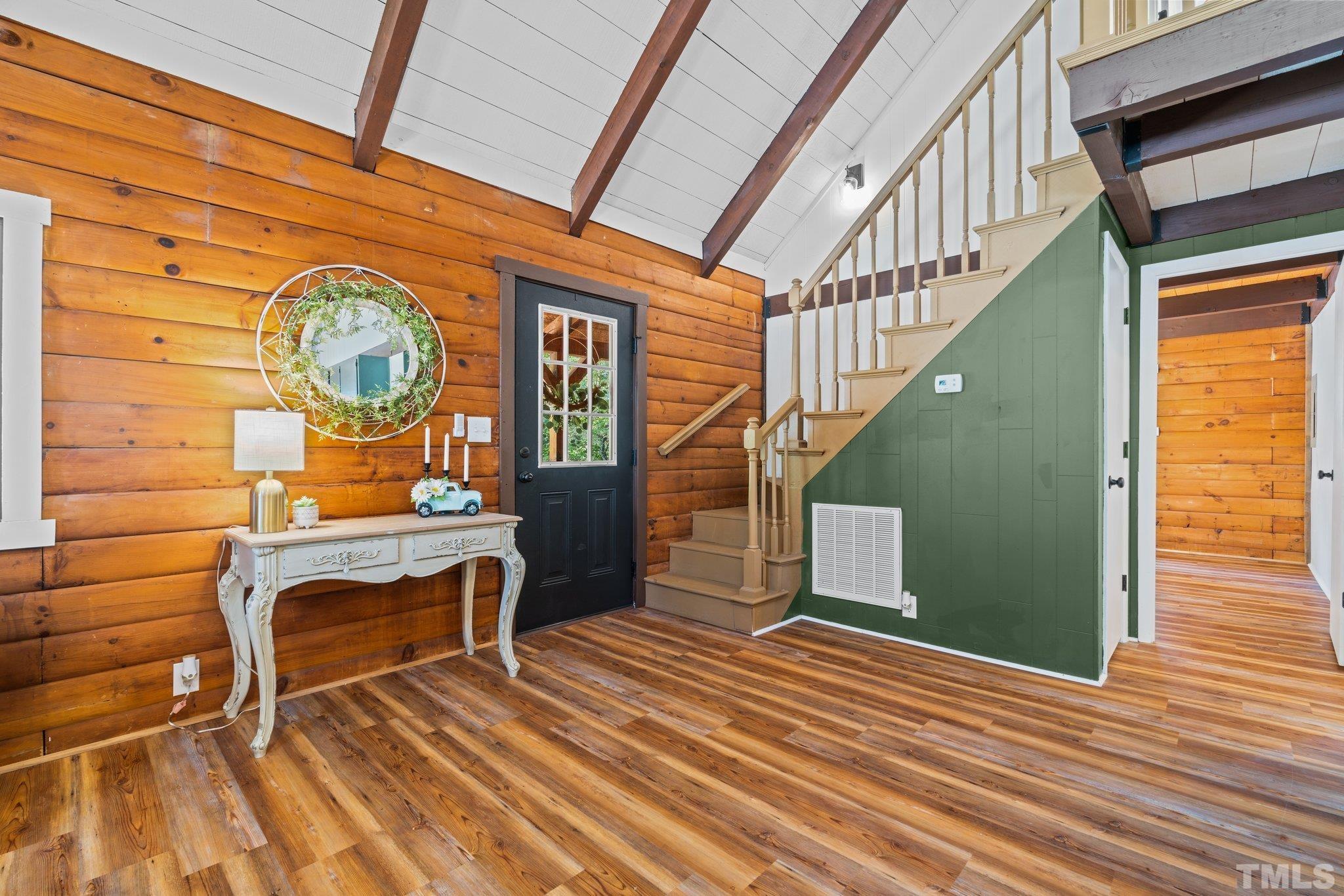 2296 Nursery Road Lillington, NC 27546 - Photo 4 of 43 a view of a hallway with wooden floor and staircase