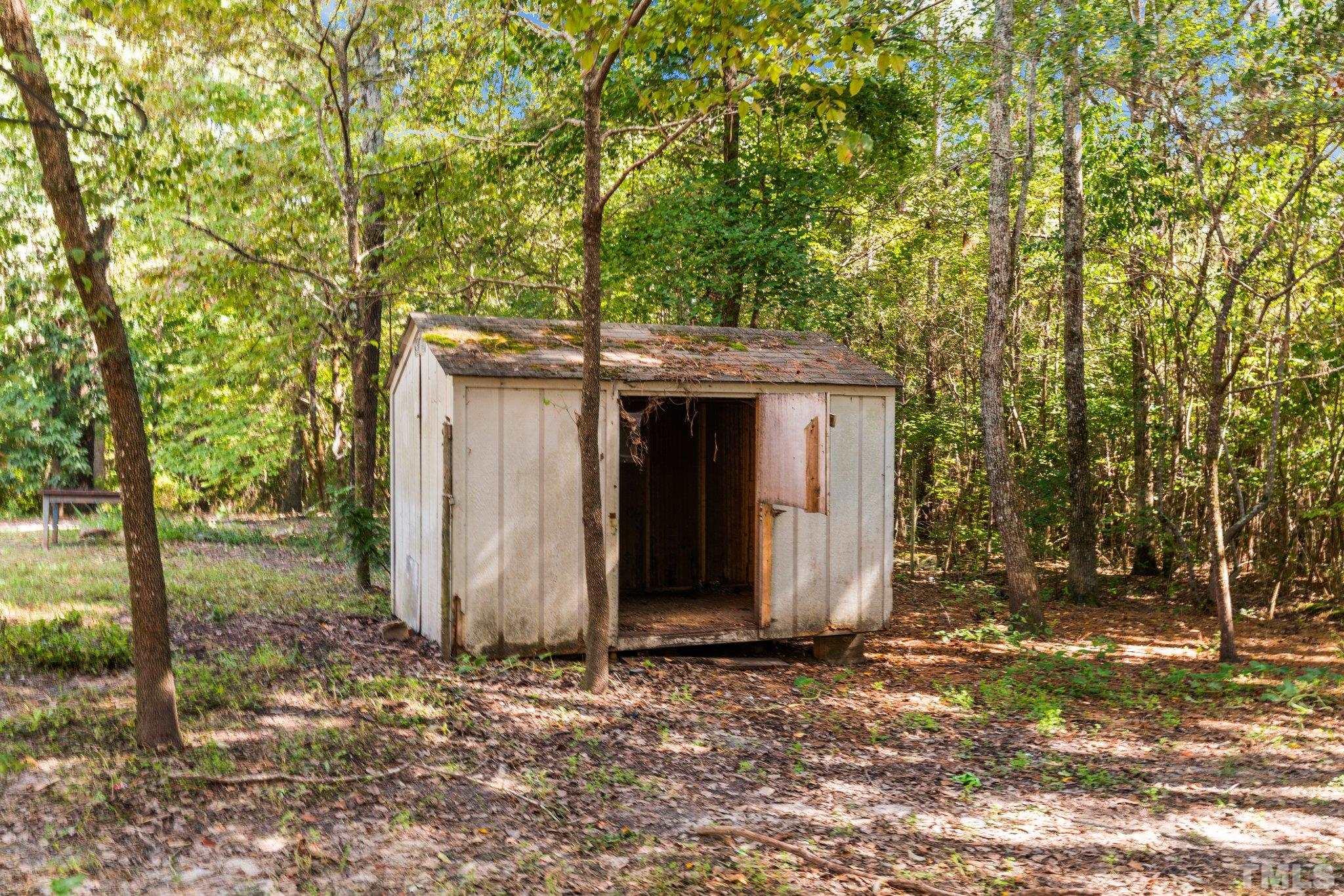 2296 Nursery Road Lillington, NC 27546 - Photo 41 of 43 a view of a barn in the middle of a yard