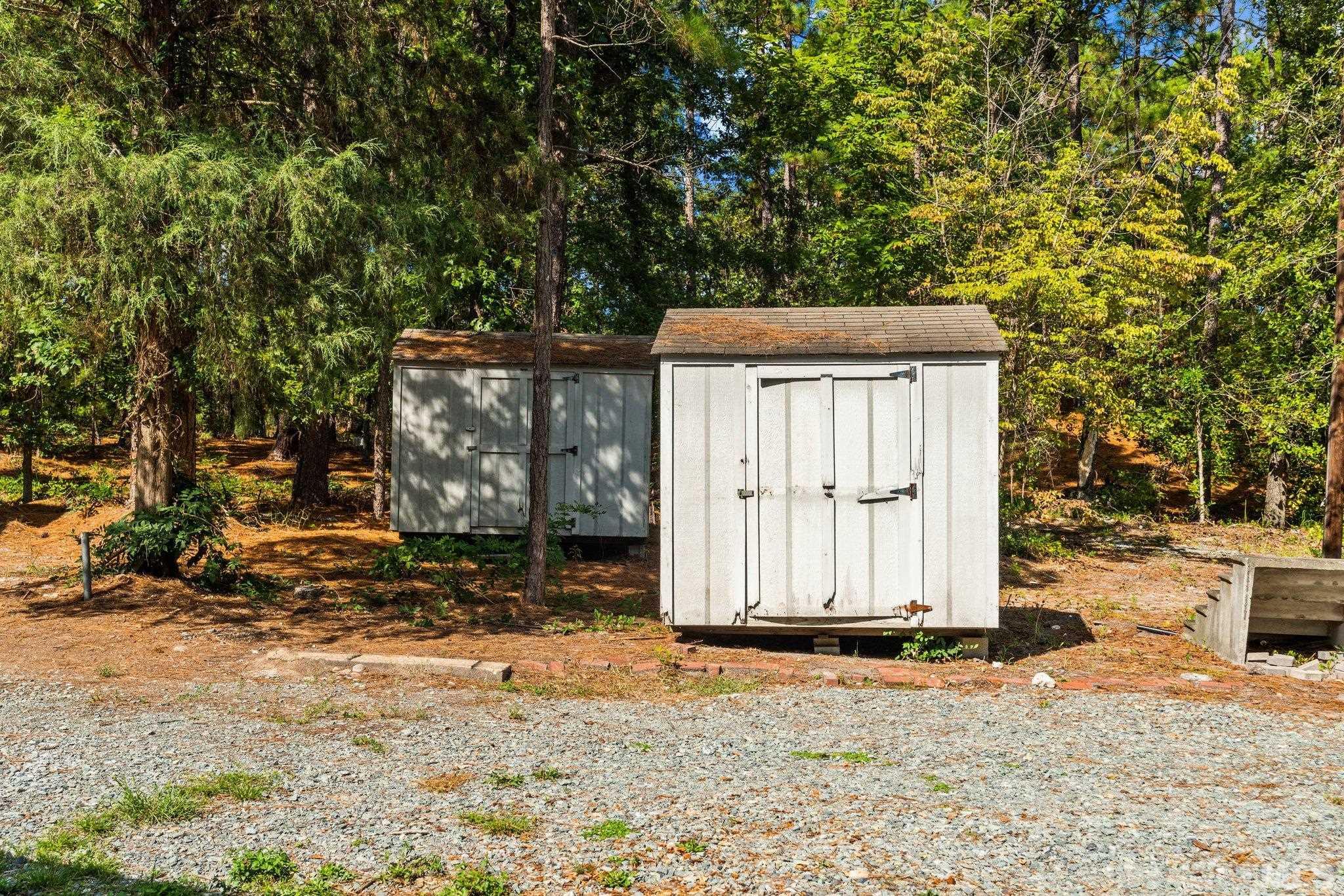 2296 Nursery Road Lillington, NC 27546 - Photo 43 of 43 a wooden house with a tree in front of it