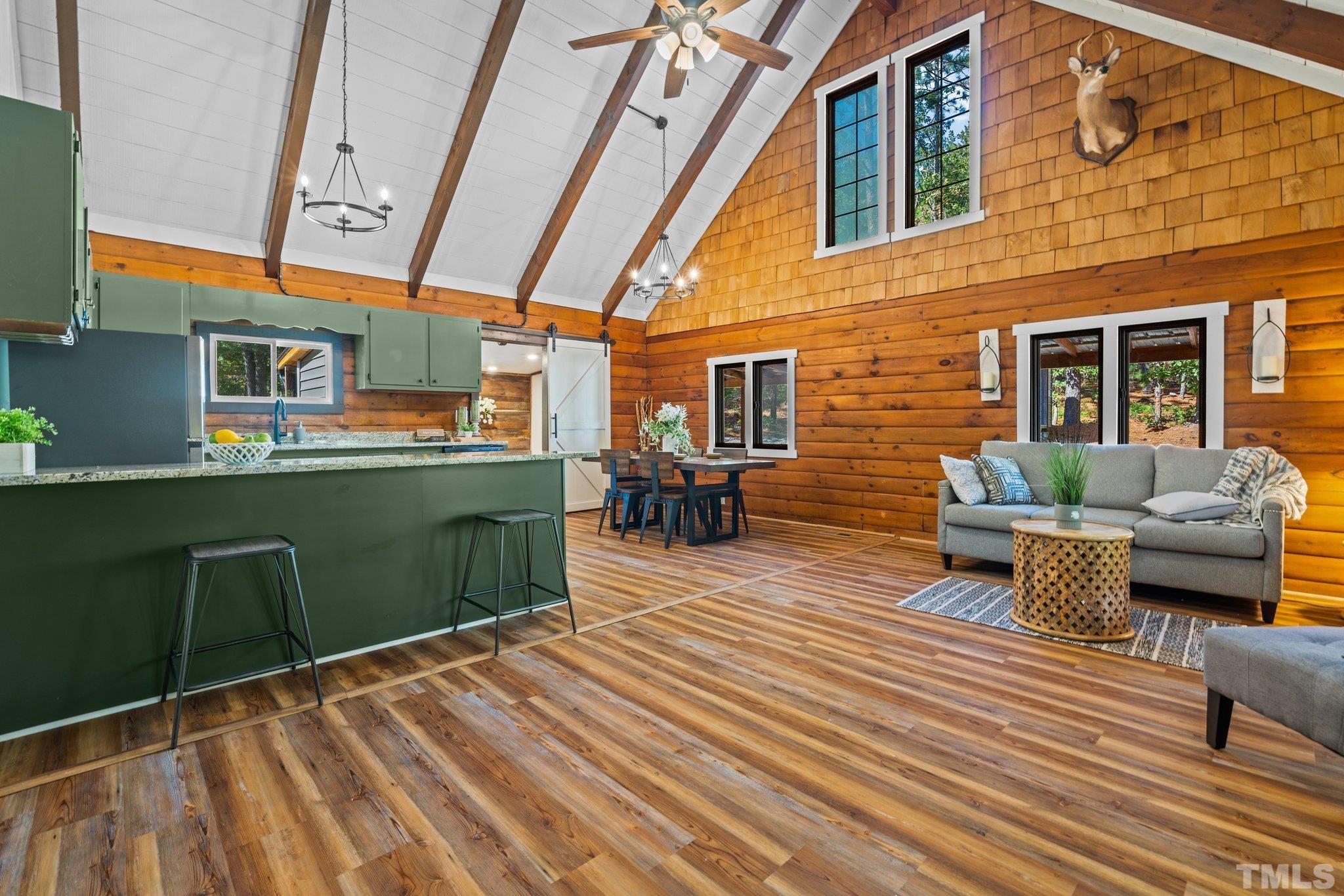 2296 Nursery Road Lillington, NC 27546 - Photo 5 of 43 a view of a patio with table and chairs barbeque with wooden floor