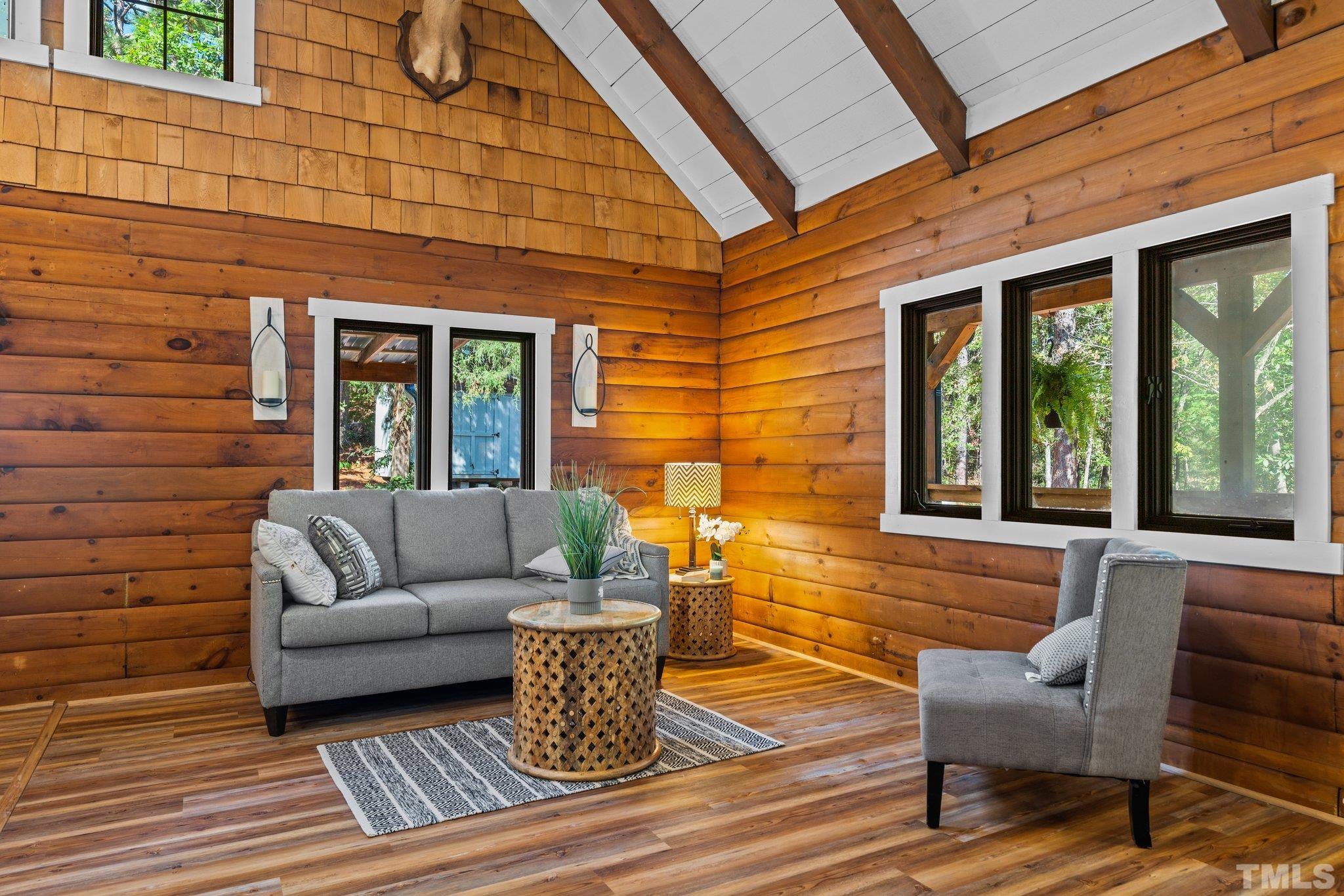 2296 Nursery Road Lillington, NC 27546 - Photo 6 of 43 a view of a patio with couches chairs and wooden floor