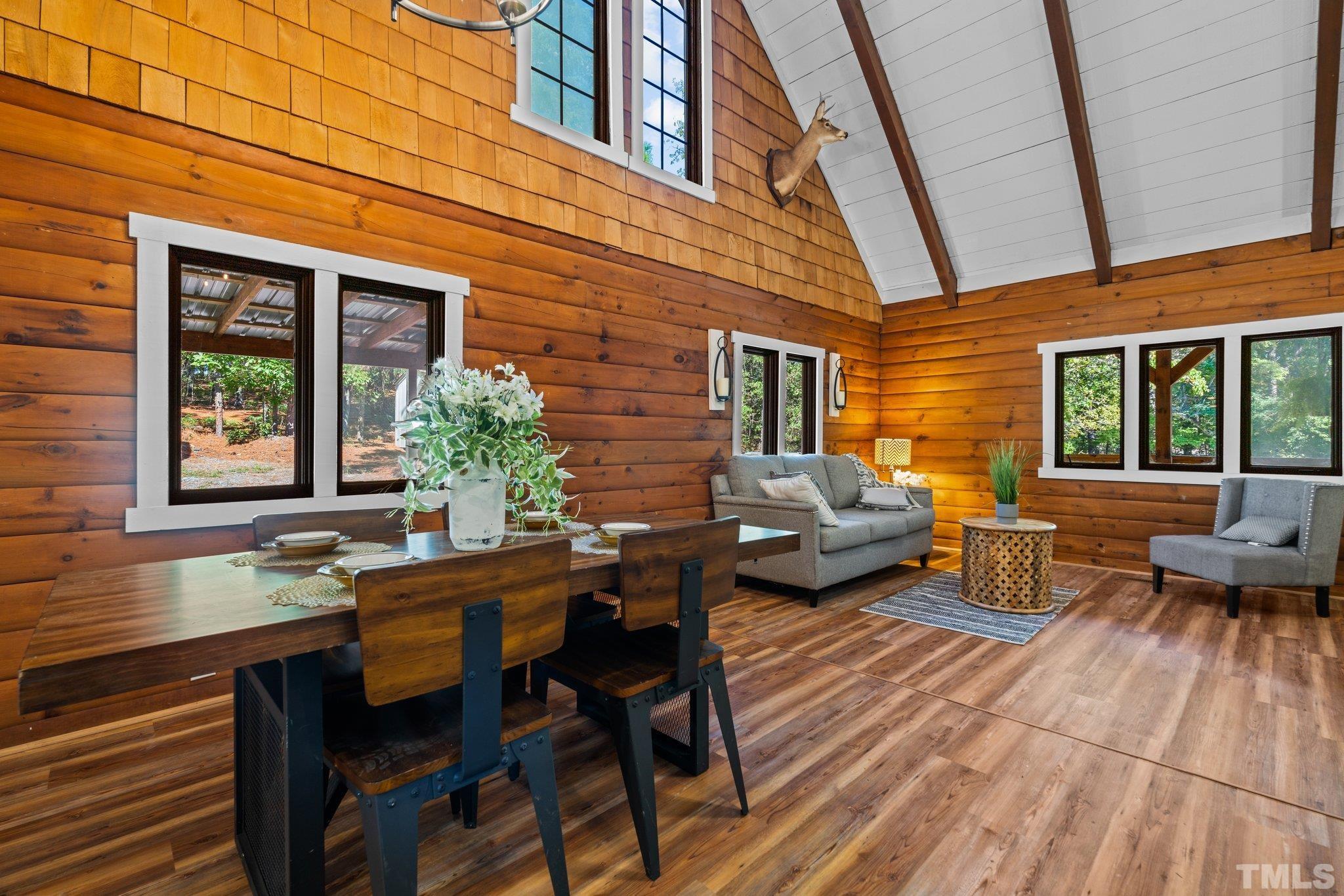 2296 Nursery Road Lillington, NC 27546 - Photo 7 of 43 a view of a patio with table and chairs with wooden floor and fence