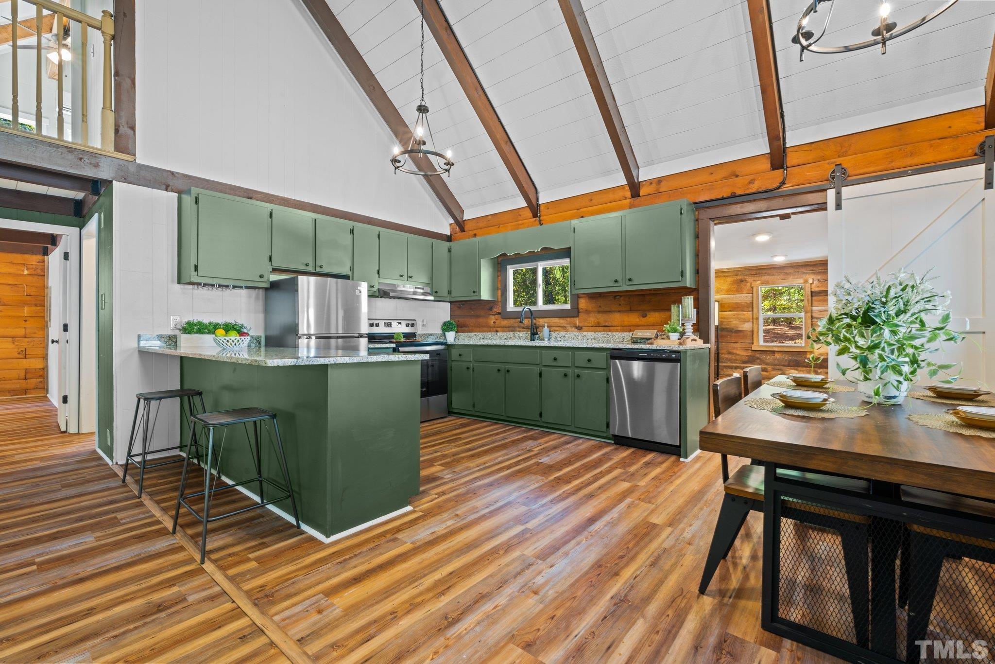 2296 Nursery Road Lillington, NC 27546 - Photo 9 of 43 a room with wooden cabinets table and chairs