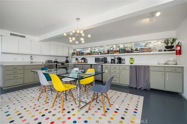 a kitchen with stainless steel appliances lots of counter top space