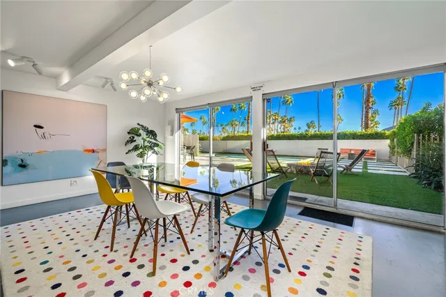 a bedroom with furniture and a wooden floor
