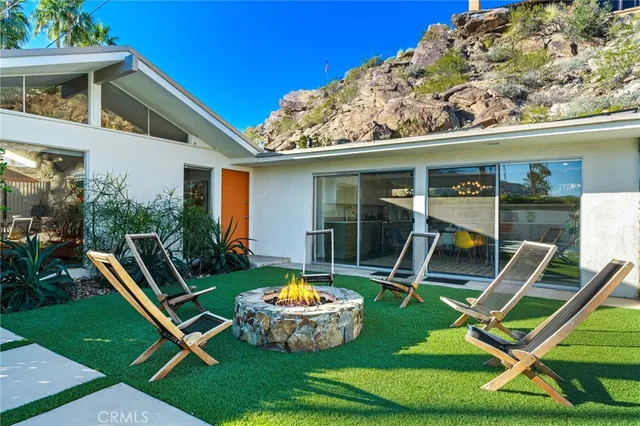 a view of swimming pool with a yard
