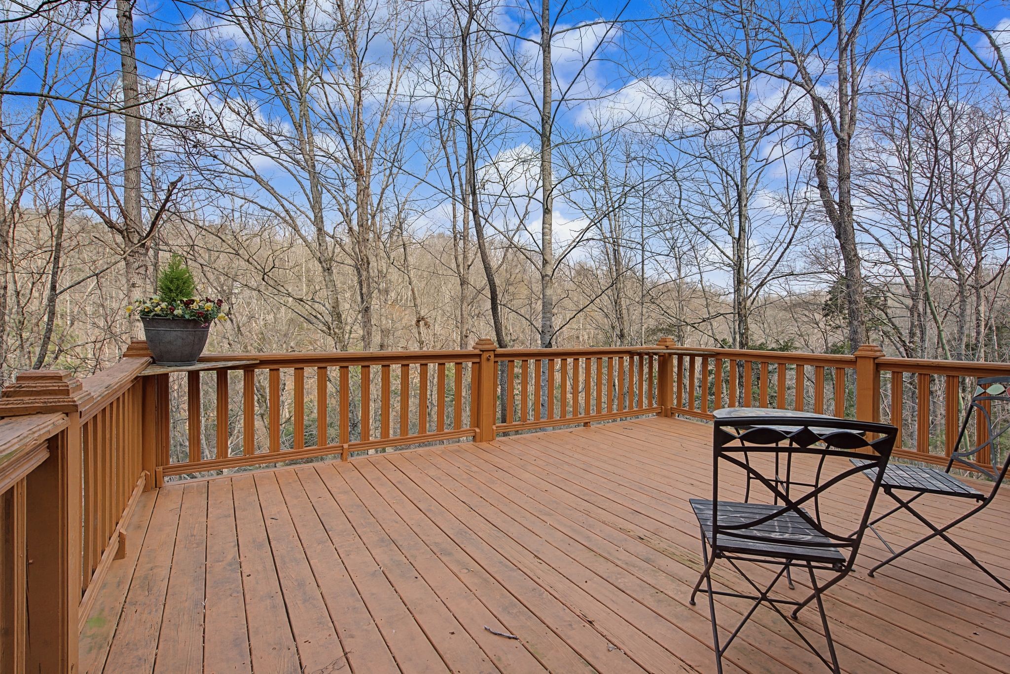 1146 Treanor Springs Road Kingston Springs, TN 37082 - Photo 18 of 31 a balcony with wooden floor and trees