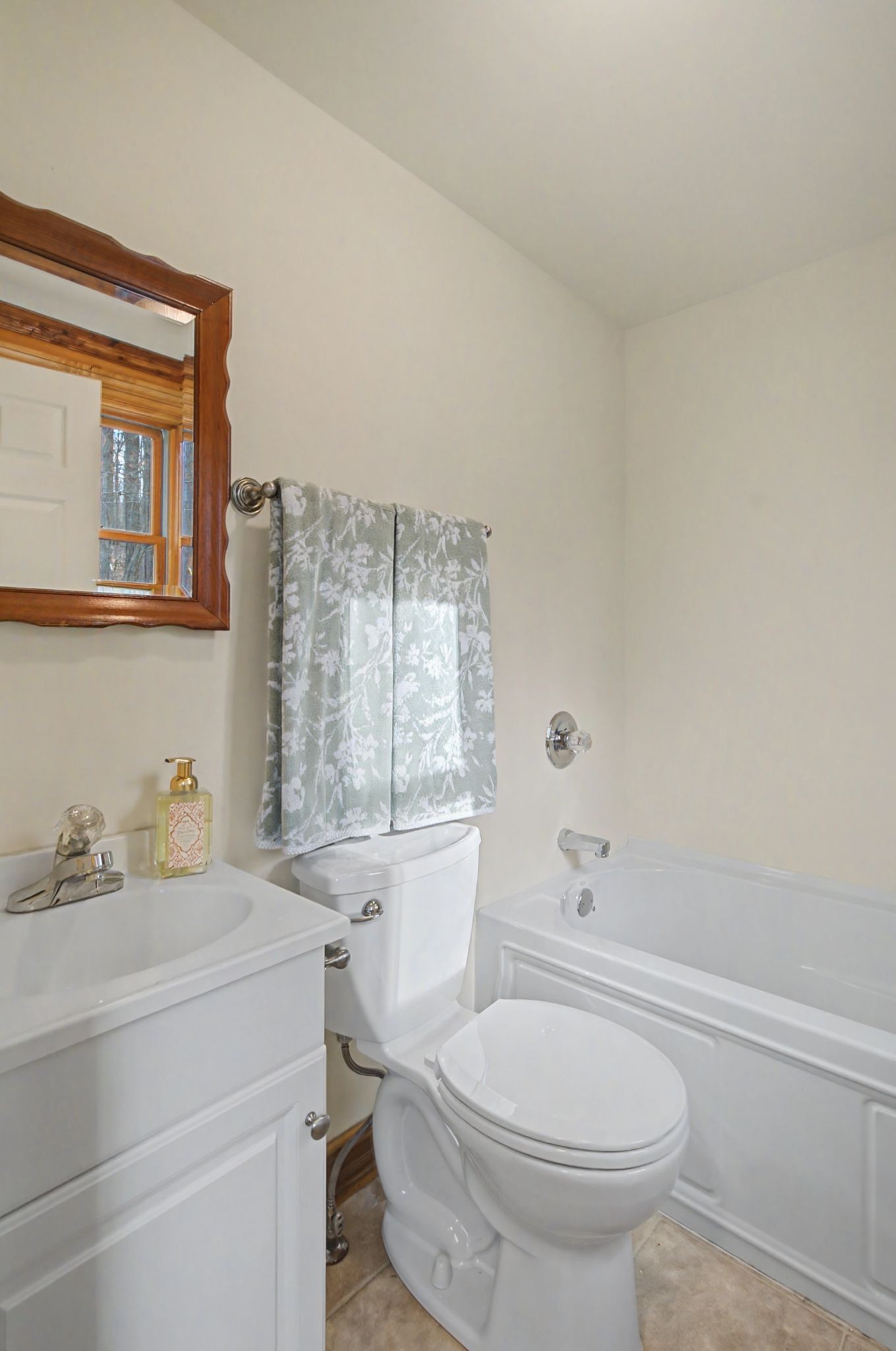 1146 Treanor Springs Road Kingston Springs, TN 37082 - Photo 7 of 31 a bathroom with a sink toilet vanity and tub