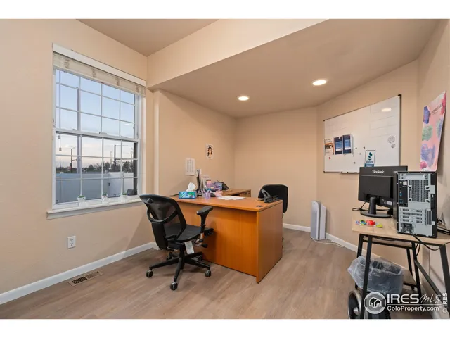 a workspace with furniture and window