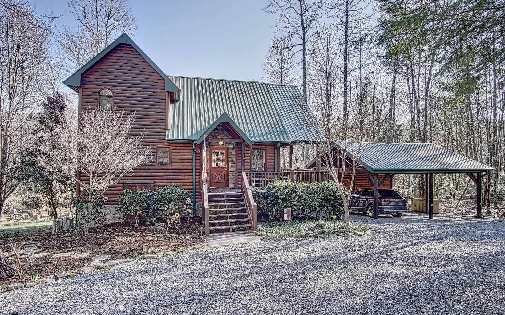 423 John's Ridge Road Blue Ridge, GA 30513 - Photo 1 of 1 a front view of a house with garden