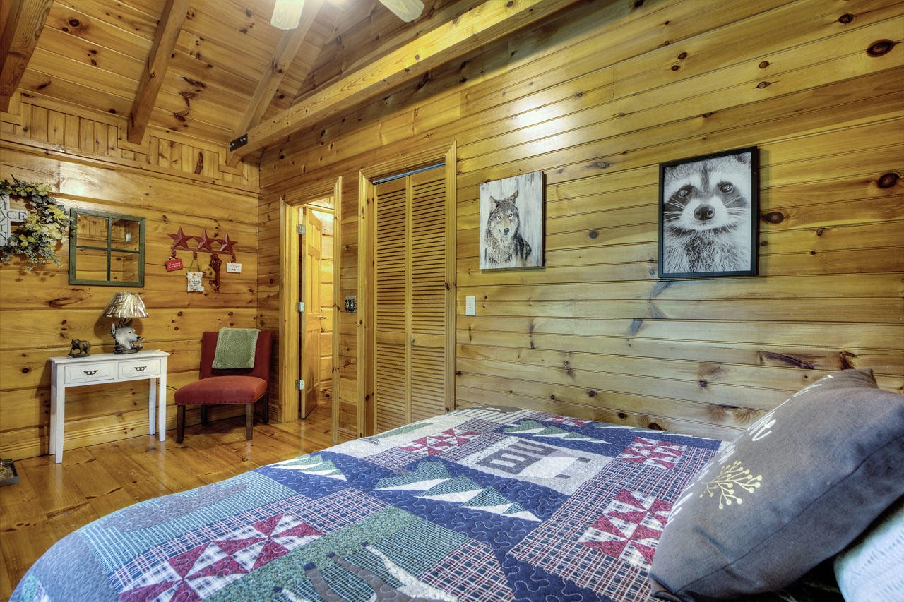 340 Doe Ridge Road Oneida, TN 37841 - Photo 12 of 40 a bedroom with a bed and furniture