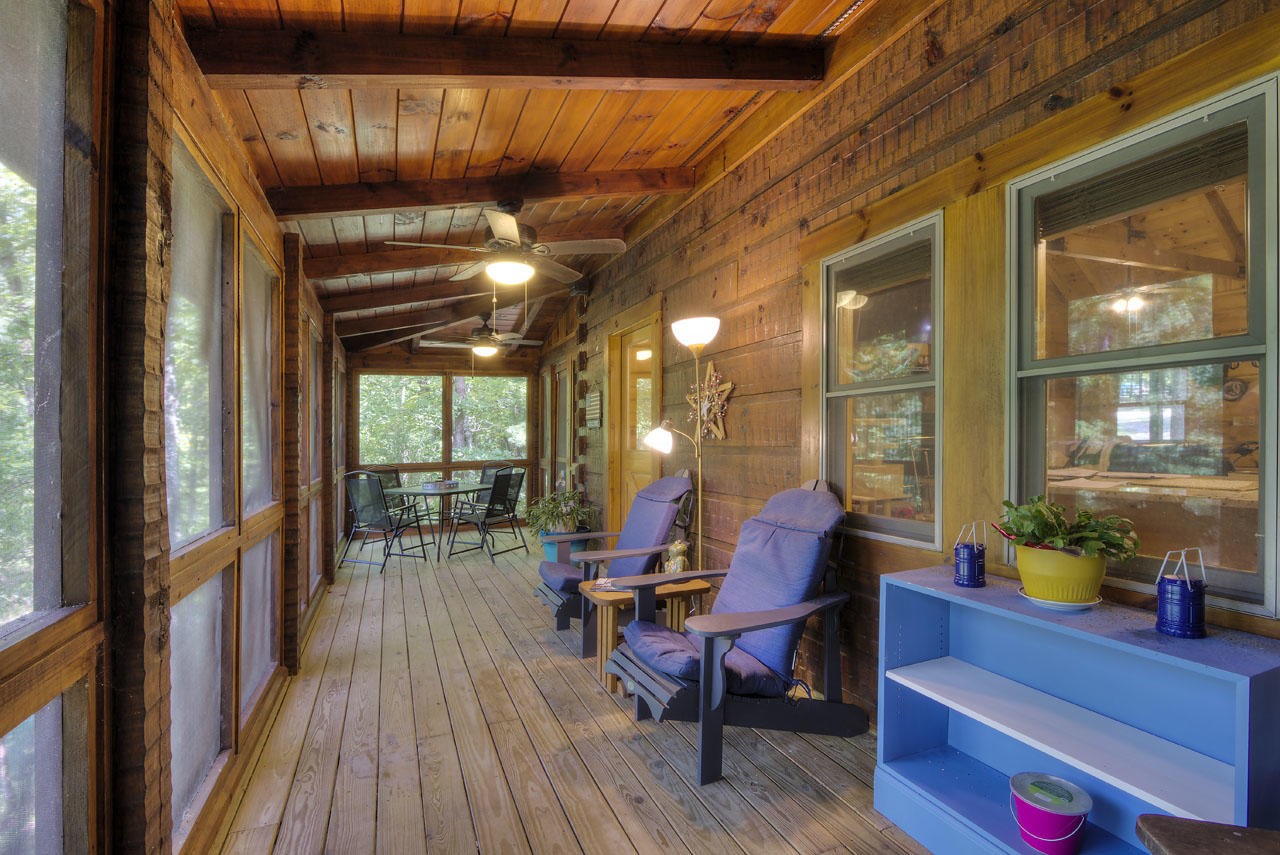 340 Doe Ridge Road Oneida, TN 37841 - Photo 2 of 40 a view of a dining room with furniture window and wooden floor