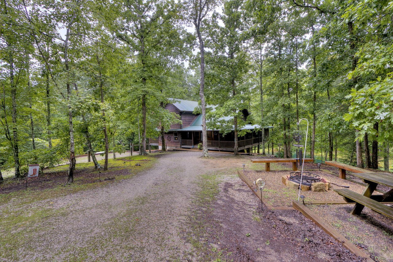 340 Doe Ridge Road Oneida, TN 37841 - Photo 26 of 40 a view of a backyard with swimming pool