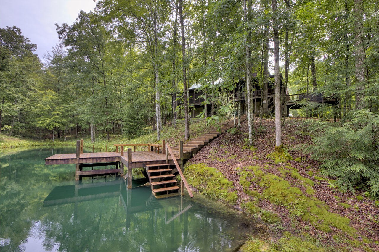 340 Doe Ridge Road Oneida, TN 37841 - Photo 32 of 40 a backyard of a house with outdoor seating