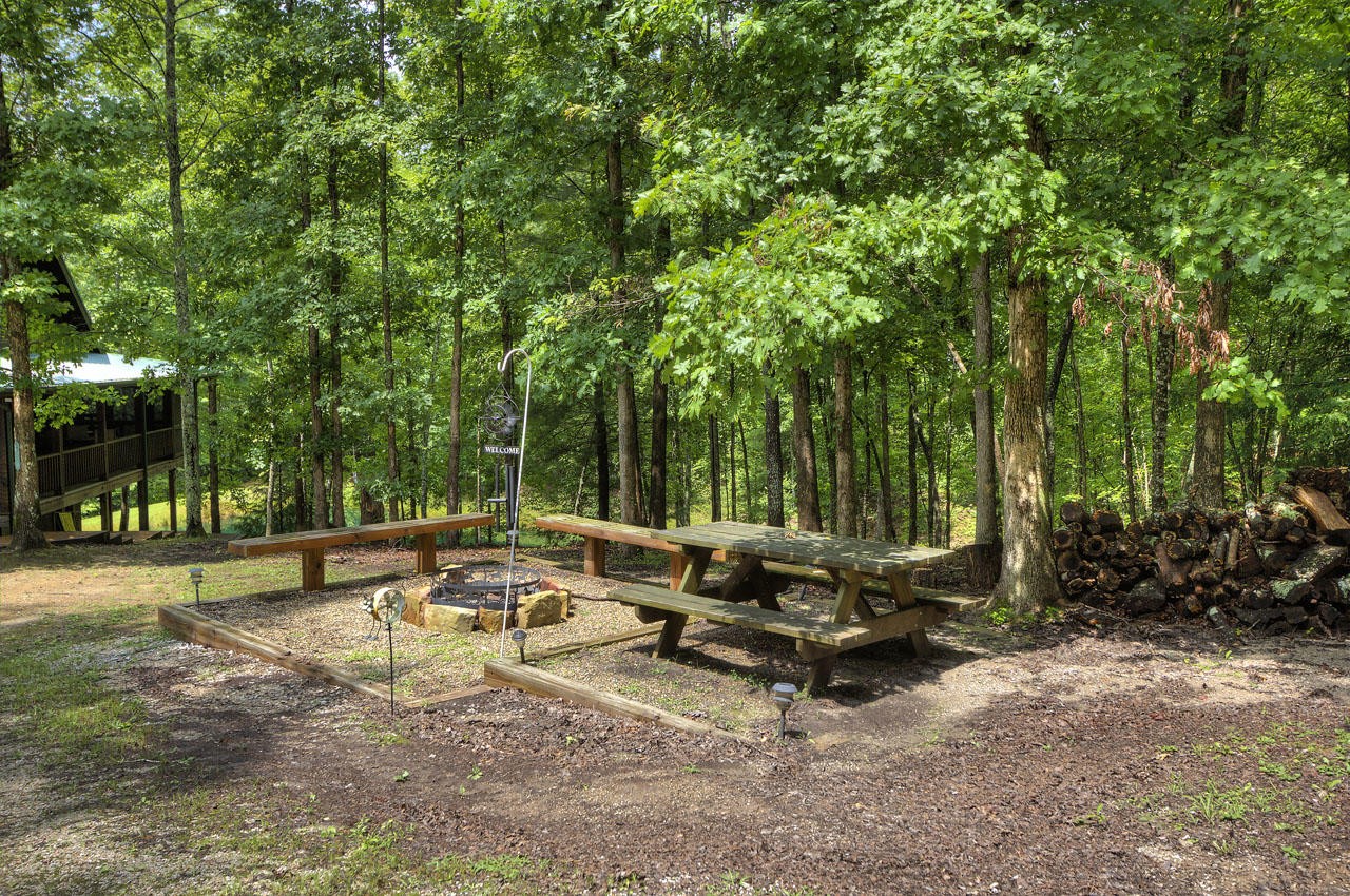340 Doe Ridge Road Oneida, TN 37841 - Photo 37 of 40 a view of a backyard with sitting area