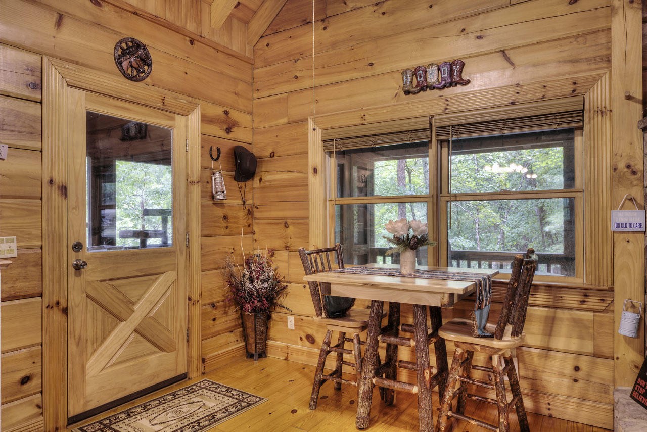 340 Doe Ridge Road Oneida, TN 37841 - Photo 6 of 40 a view of a dining room with furniture window and outside view