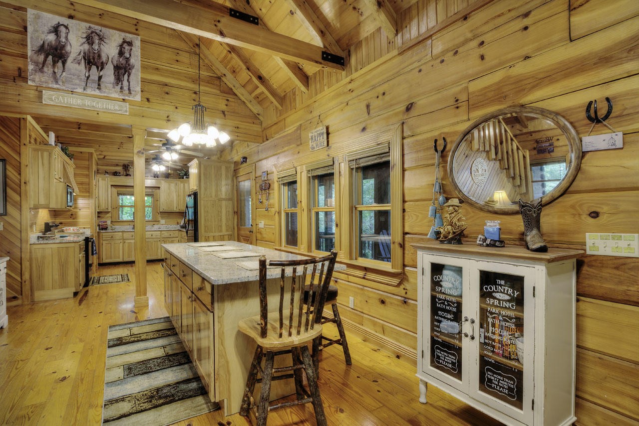 340 Doe Ridge Road Oneida, TN 37841 - Photo 7 of 40 a dining room with a wooden table and chairs