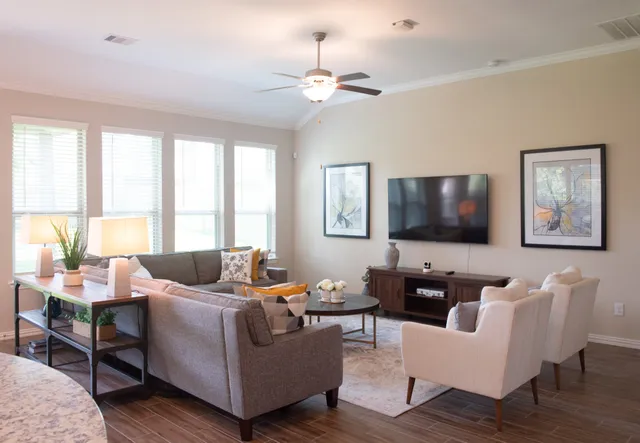 a living room with furniture and a flat screen tv