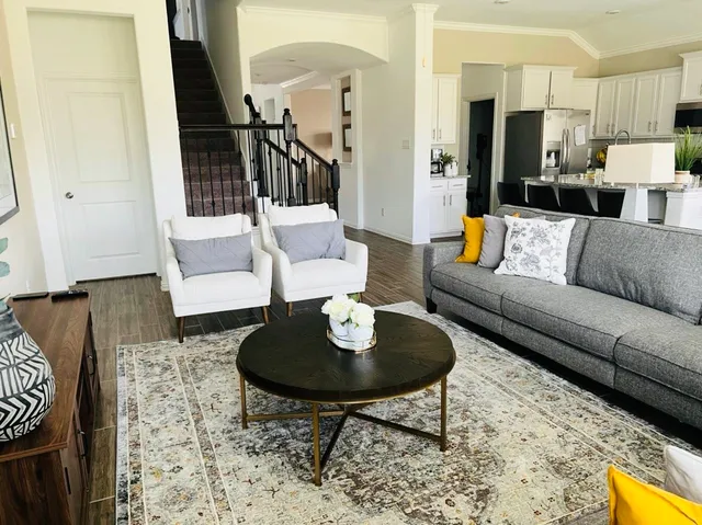 a living room with furniture and a table