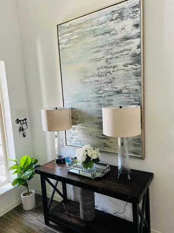 a living room with furniture and a potted plant