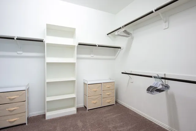 a view of an empty walk in closet