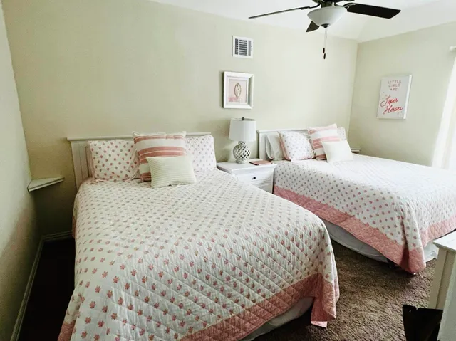 a bedroom with bed and a night stand