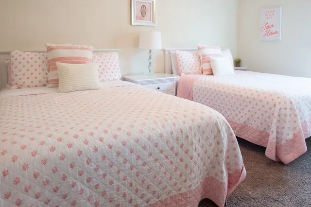 a bedroom with double bed and a couch