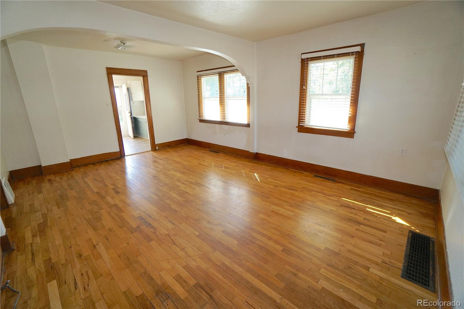 322 3rd Street Frederick, CO 80530 - Photo 12 of 30 a view of empty room with wooden floor and fan
