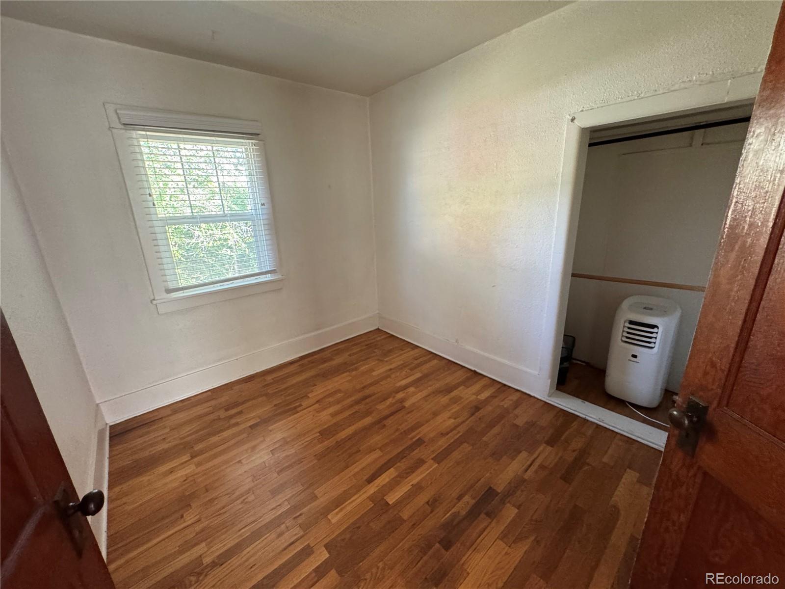 322 3rd Street Frederick, CO 80530 - Photo 16 of 30 a view of a room with wooden floor and sink