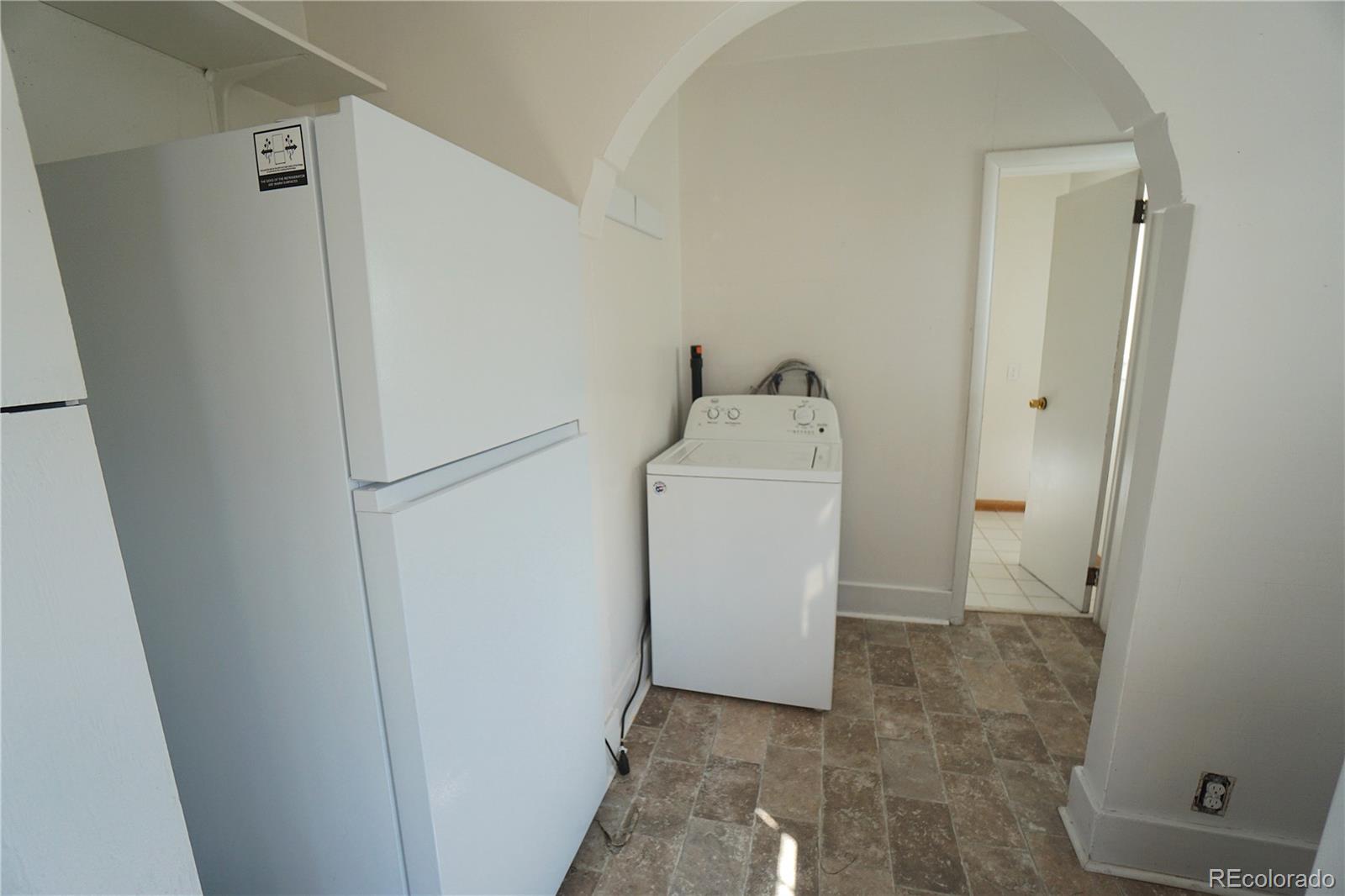 322 3rd Street Frederick, CO 80530 - Photo 21 of 30 a view of bathroom with a washer and dryer