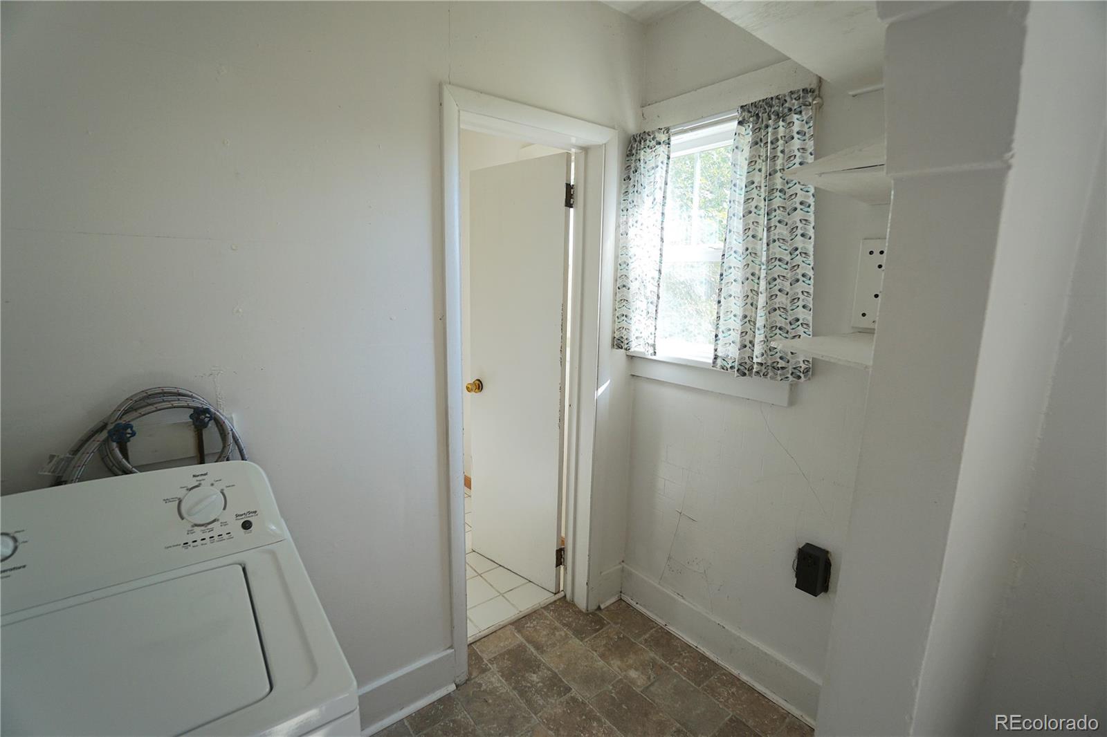 322 3rd Street Frederick, CO 80530 - Photo 22 of 30 a view of bathroom with baby crib