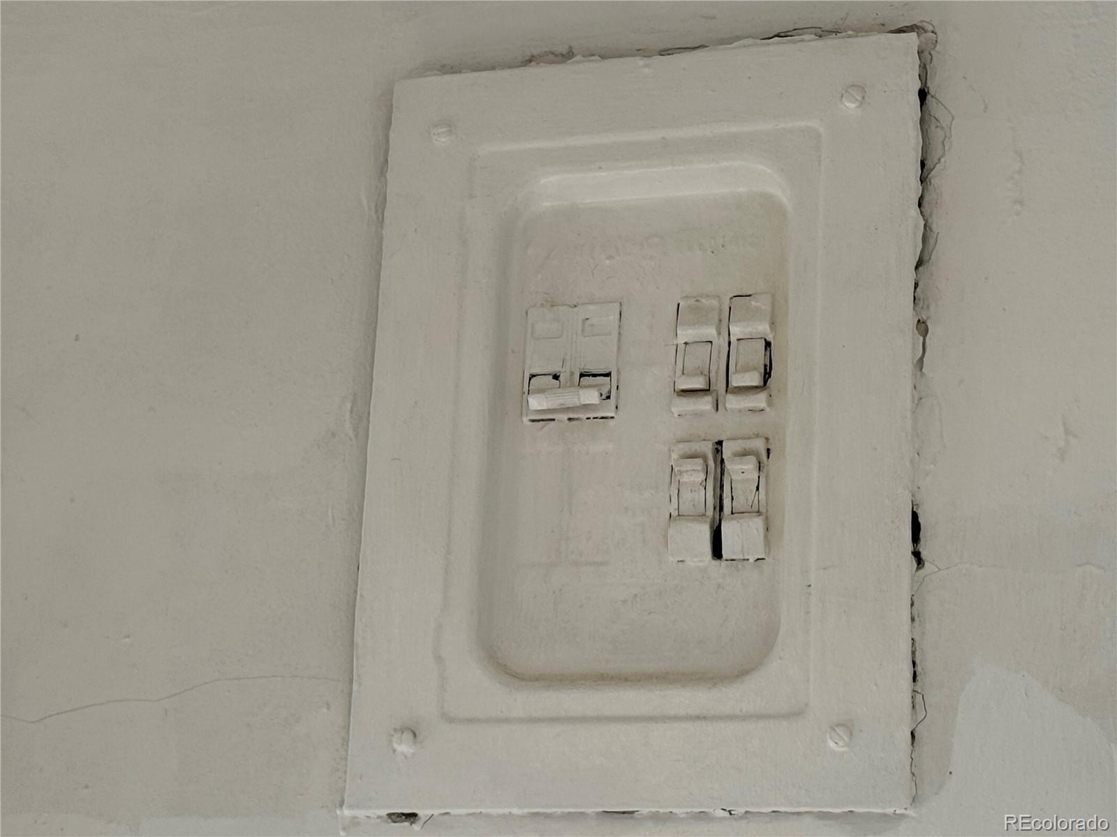 322 3rd Street Frederick, CO 80530 - Photo 29 of 30 a bathroom with a glass shower door