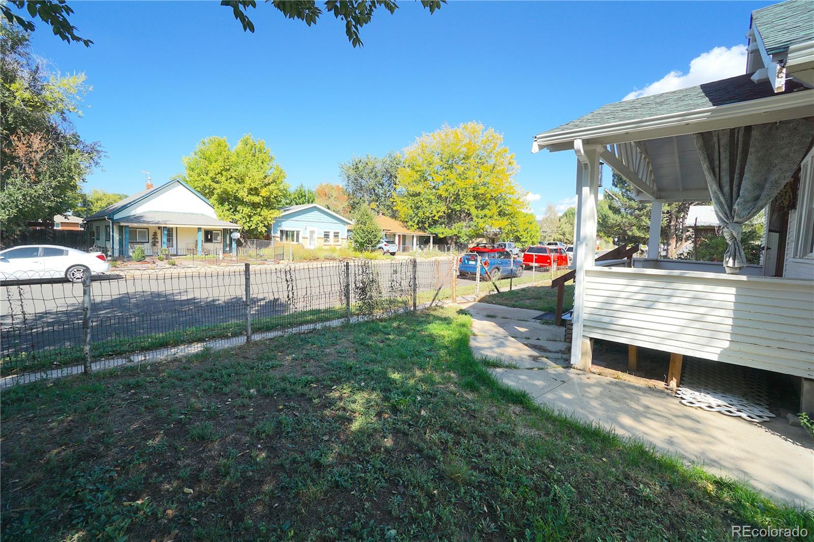 322 3rd Street Frederick, CO 80530 - Photo 10 of 30 a view of a chair and table in backyard