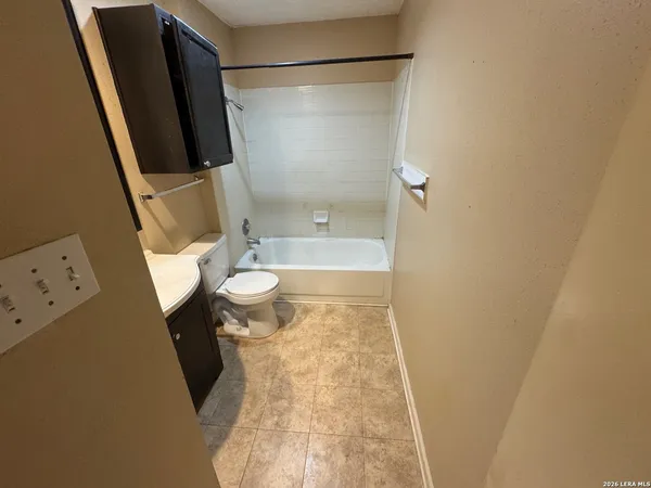 a bathroom with a sink and toilet