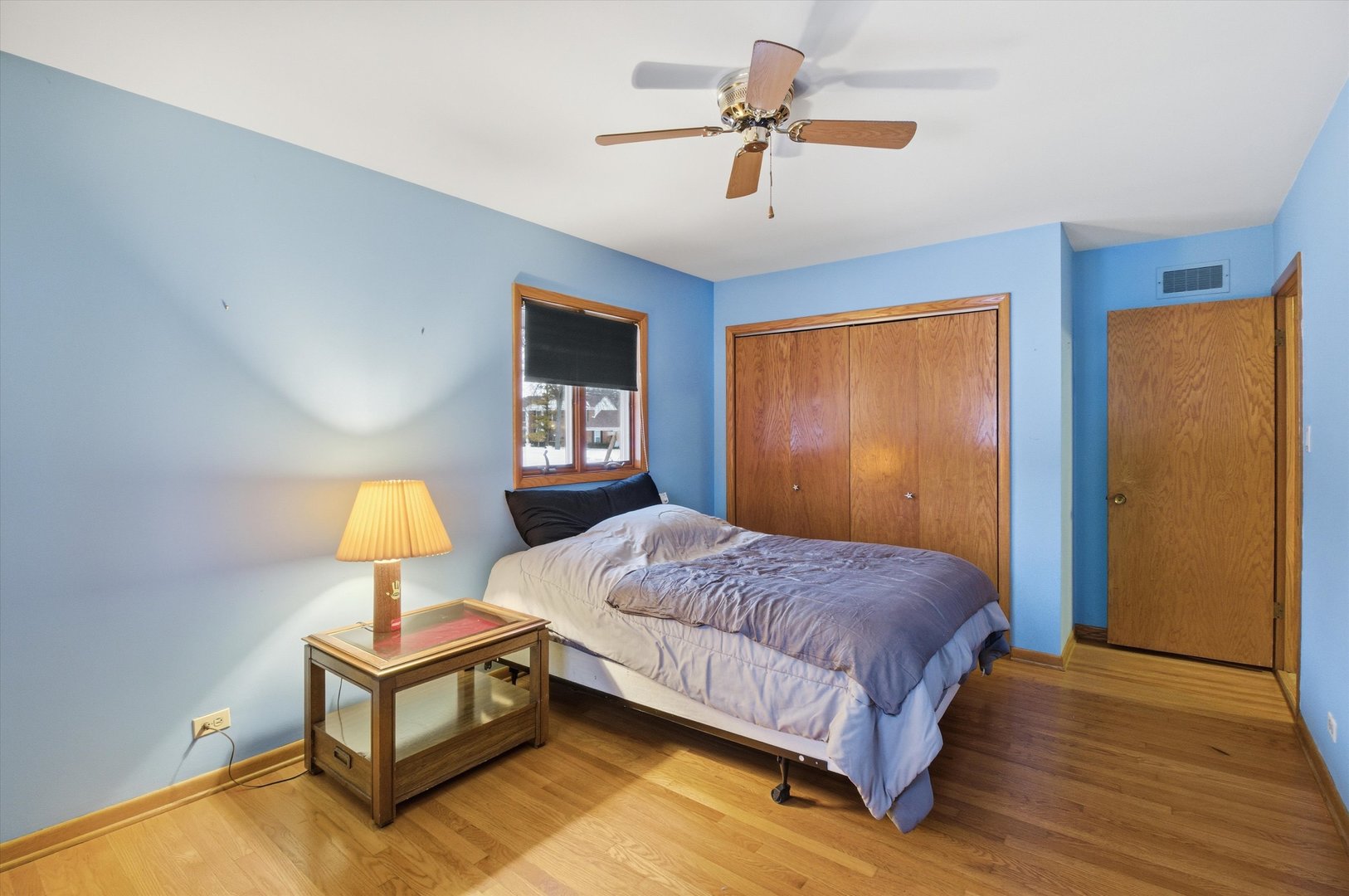 219 North Prospect Street Roselle, IL 60172 - Photo 19 of 34 a bedroom with a bed lamp on table and a window