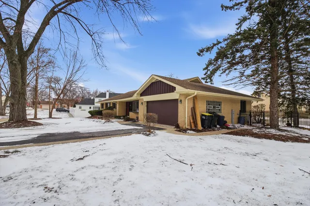 a view of a house with a snow in front of it