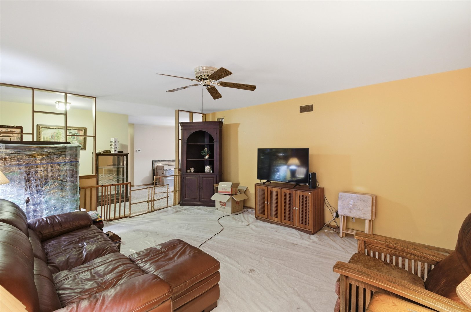 219 North Prospect Street Roselle, IL 60172 - Photo 7 of 34 a living room with furniture and a flat screen tv