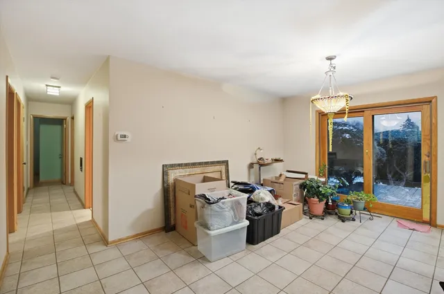 a spacious bathroom with a granite countertop sink mirror and a
