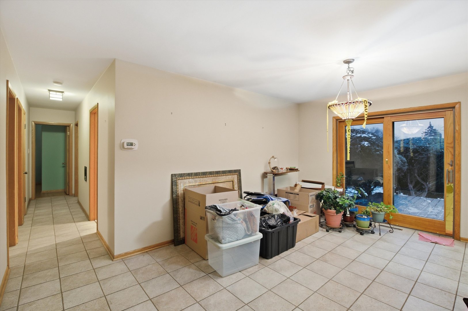 219 North Prospect Street Roselle, IL 60172 - Photo 9 of 34 a view of a workspace with furniture and a chandelier